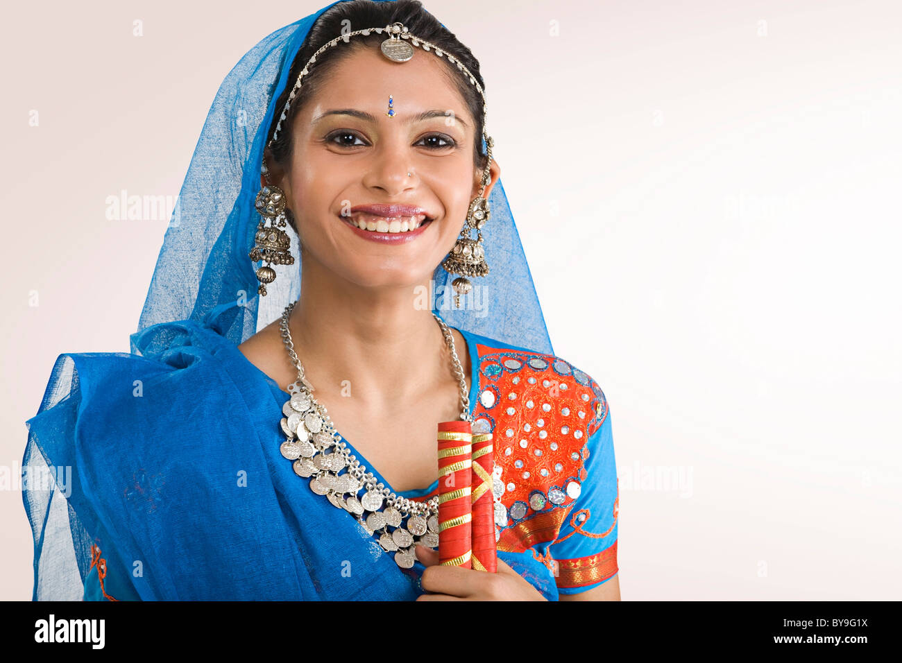 Gujarati woman with dandiya sticks Stock Photo Alamy