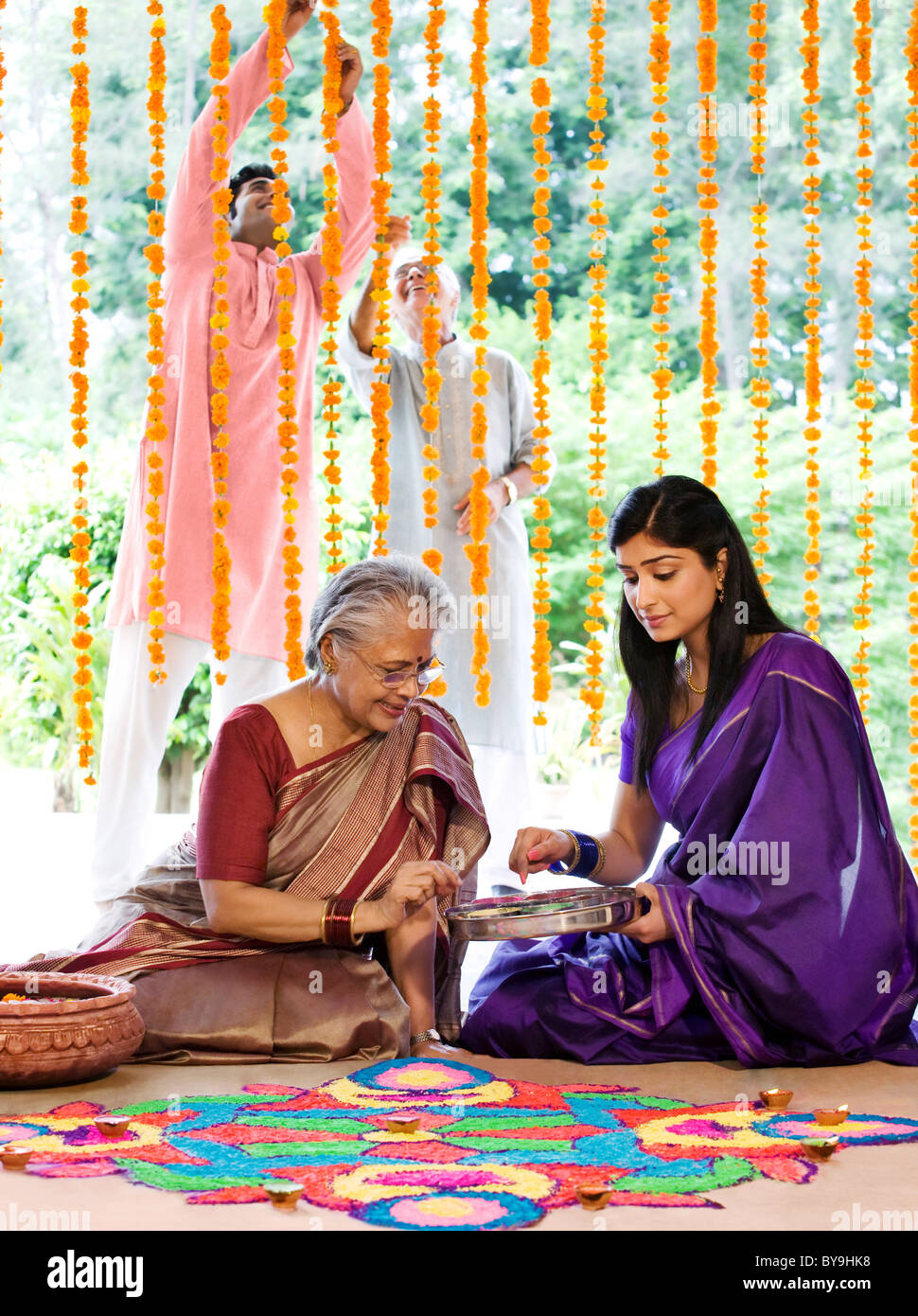 Mother daughter making rangoli hi-res stock photography and images - Alamy