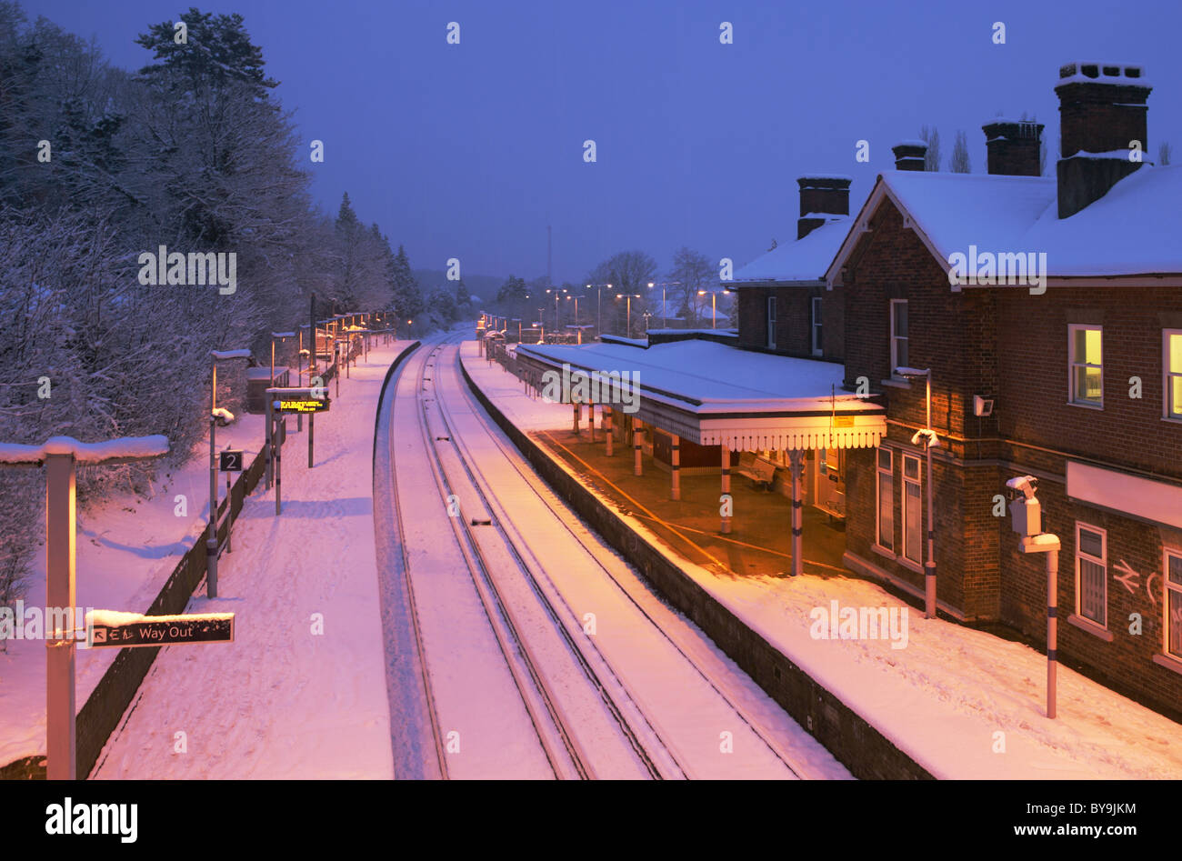 Otford railway station in snow at dusk Stock Photo