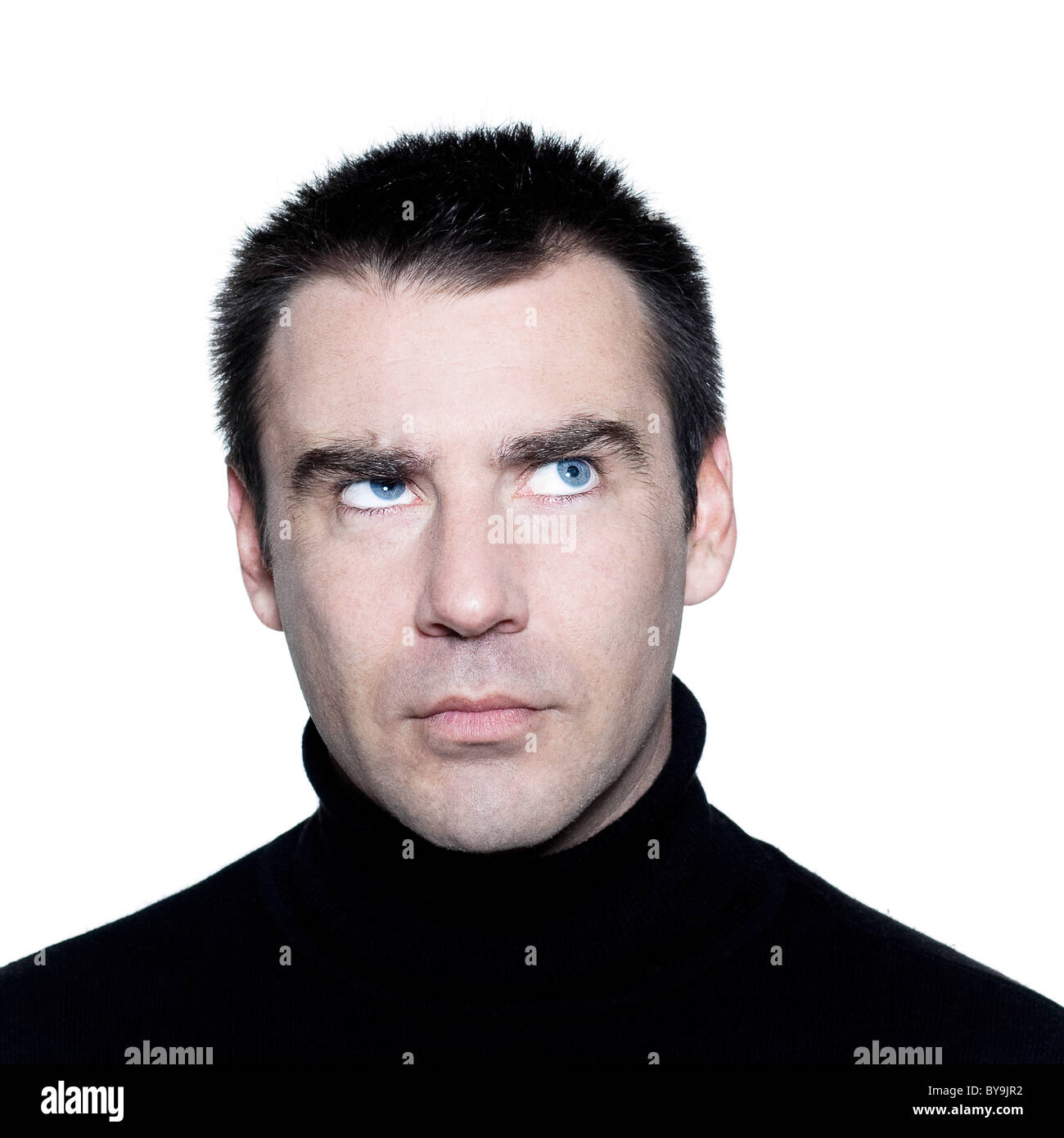 caucasian man portrait  thinking pensive doubt mistrust distrust looking up portrait on studio isolated white background Stock Photo