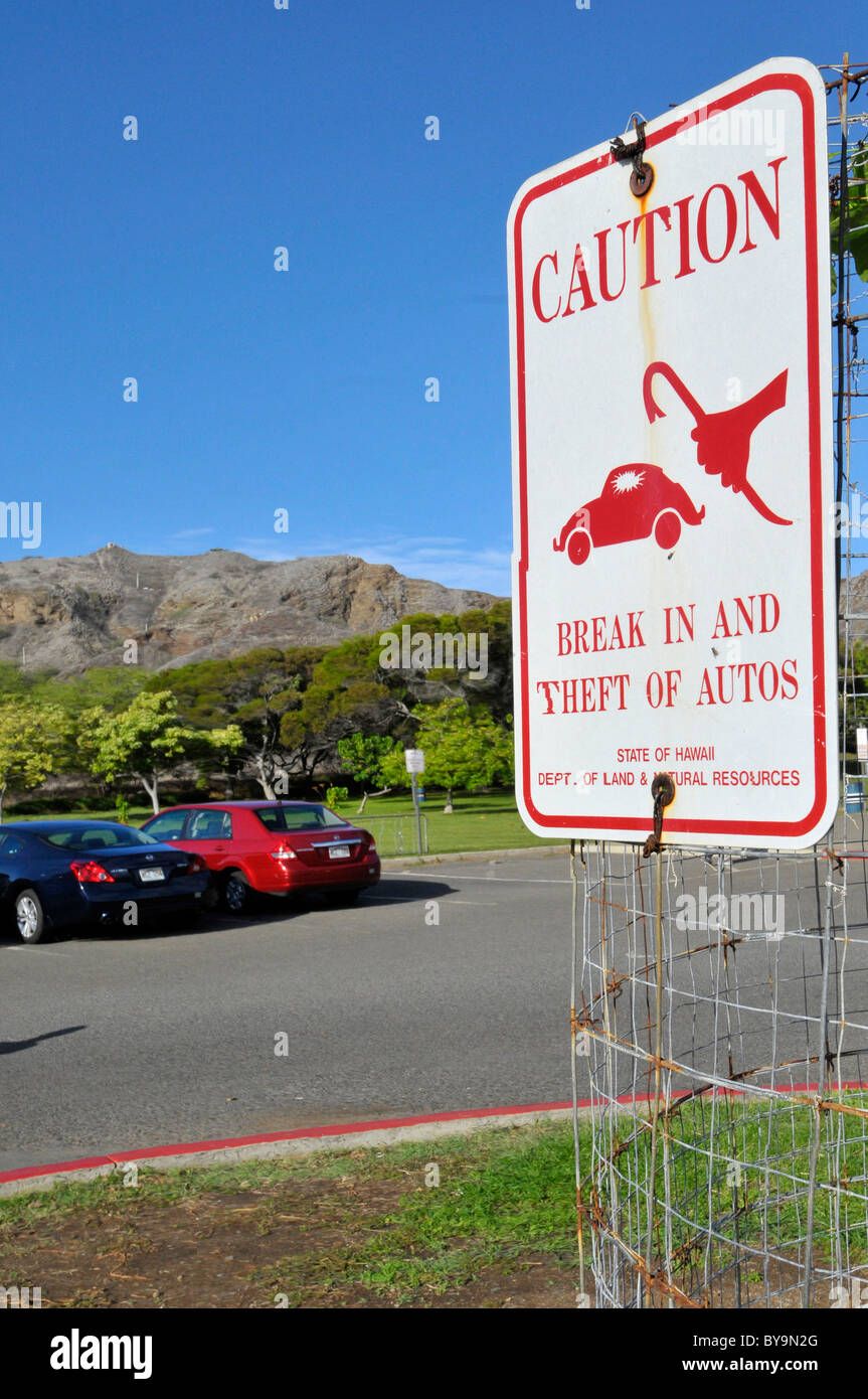 Warning Sign about car theft and break in Honolulu Hawaii Oahu Pacific Ocean Stock Photo