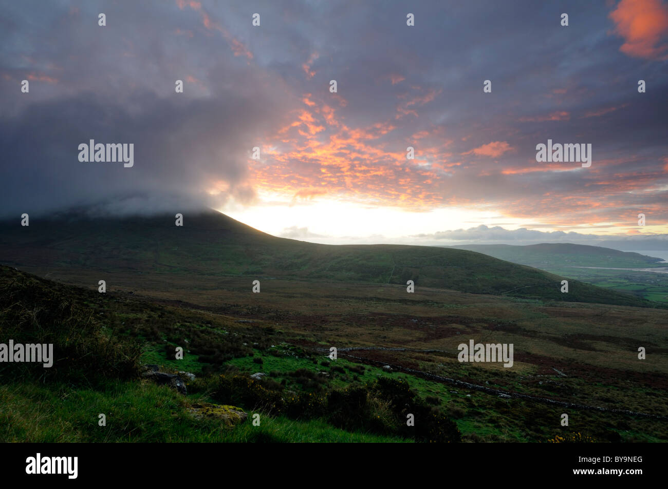 knockmylemore mountain brandon range kerry sunrise dramatic dram sky skies rolling low lying cloud Stock Photo