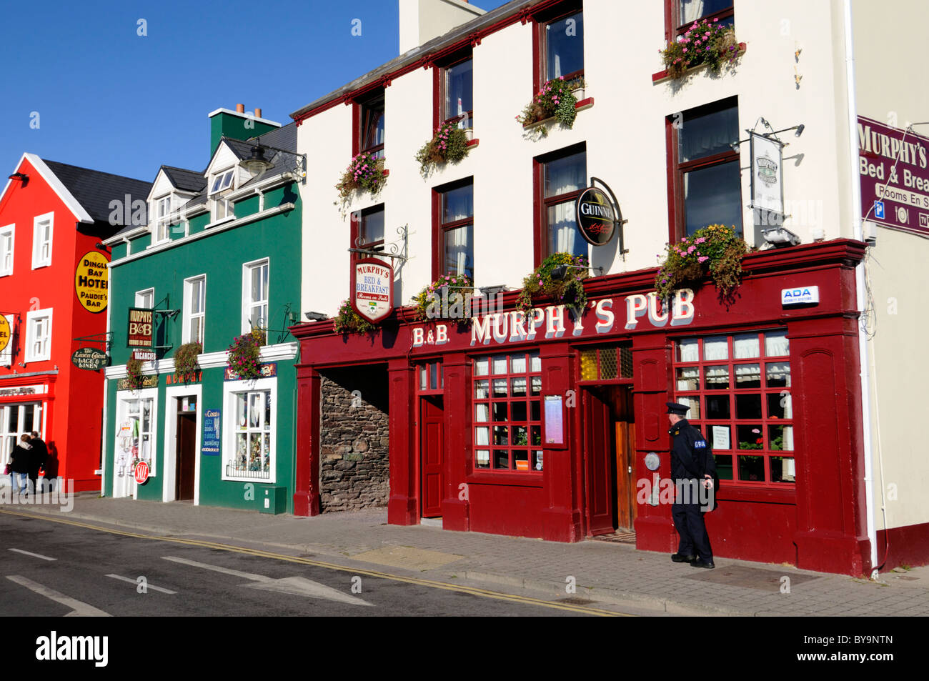 Public house bar pub licensed premises rural ireland dingle peninsula ring of kerry front frontage facade outside policeman Stock Photo
