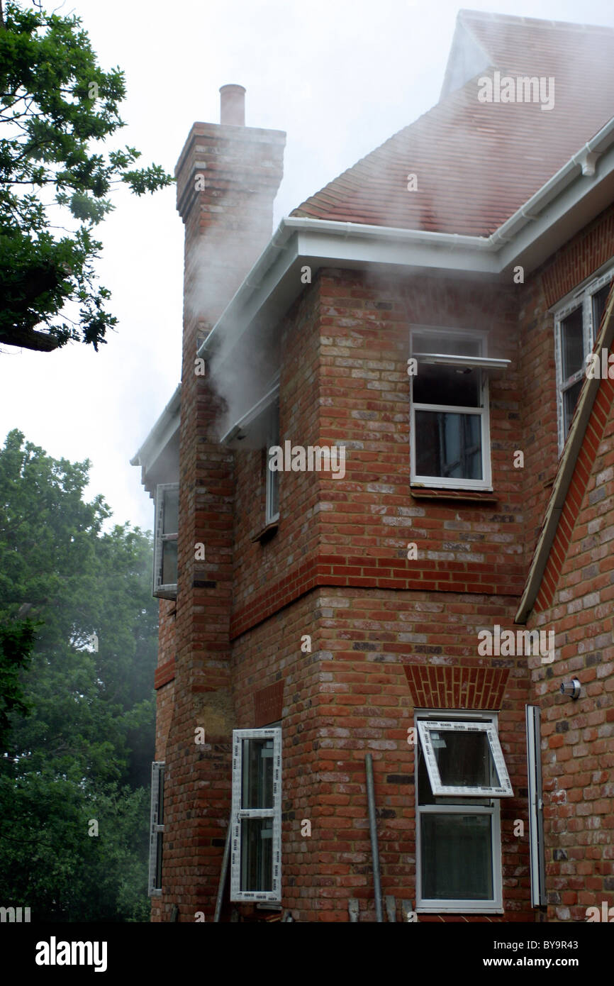 Smoke coming from a house on fire Stock Photo Alamy
