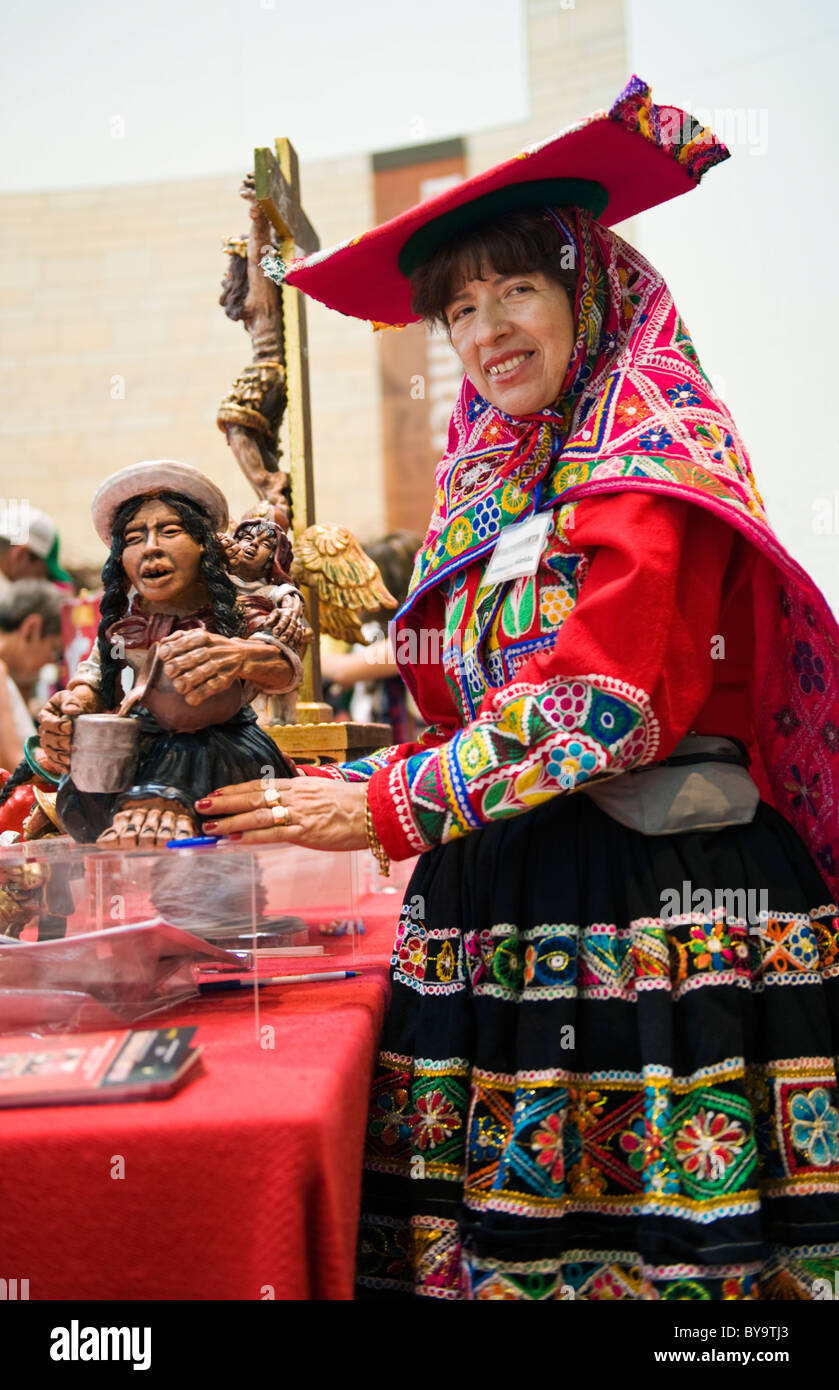 A Peruvian Woman in traditional dress selling her artwork at a celebration of Peruvian culture in Washington DC. Stock Photo