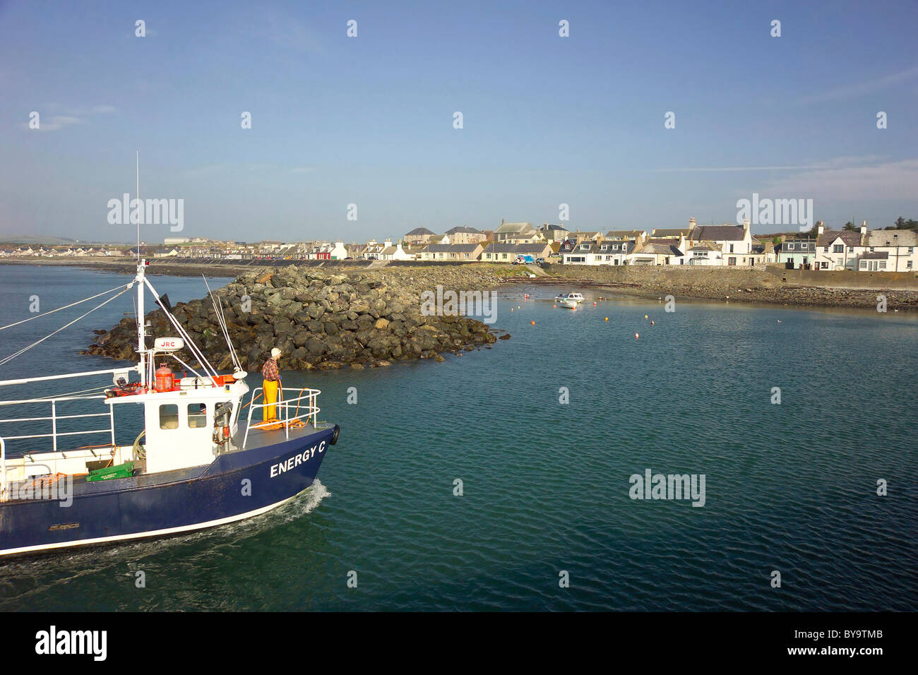 Port William harbour with approaching fishing vessel Machars of Wigtownshire Stock Photo