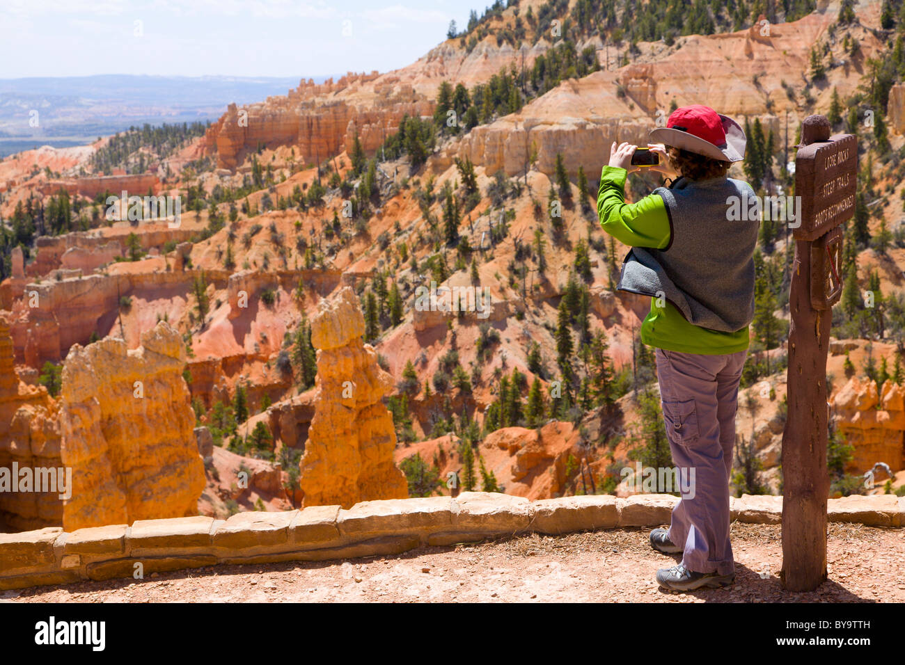 Tourist taking a picture of the scenery in Bryce Canyon Stock Photo