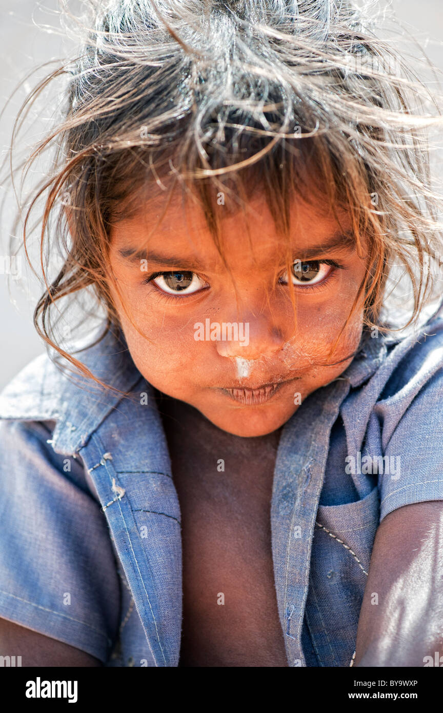 Shy happy young poor lower caste Indian street girl smiling. Andhra Pradesh, India Stock Photo