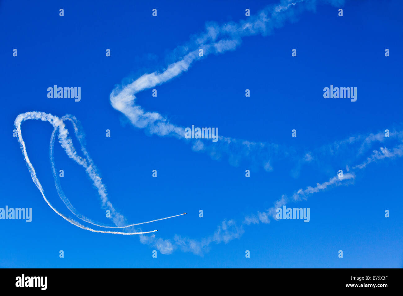 Victa and Texan planes with plumes of smoke  in aerobatic flying display. Australia Day celebrations 2011, Perth Stock Photo