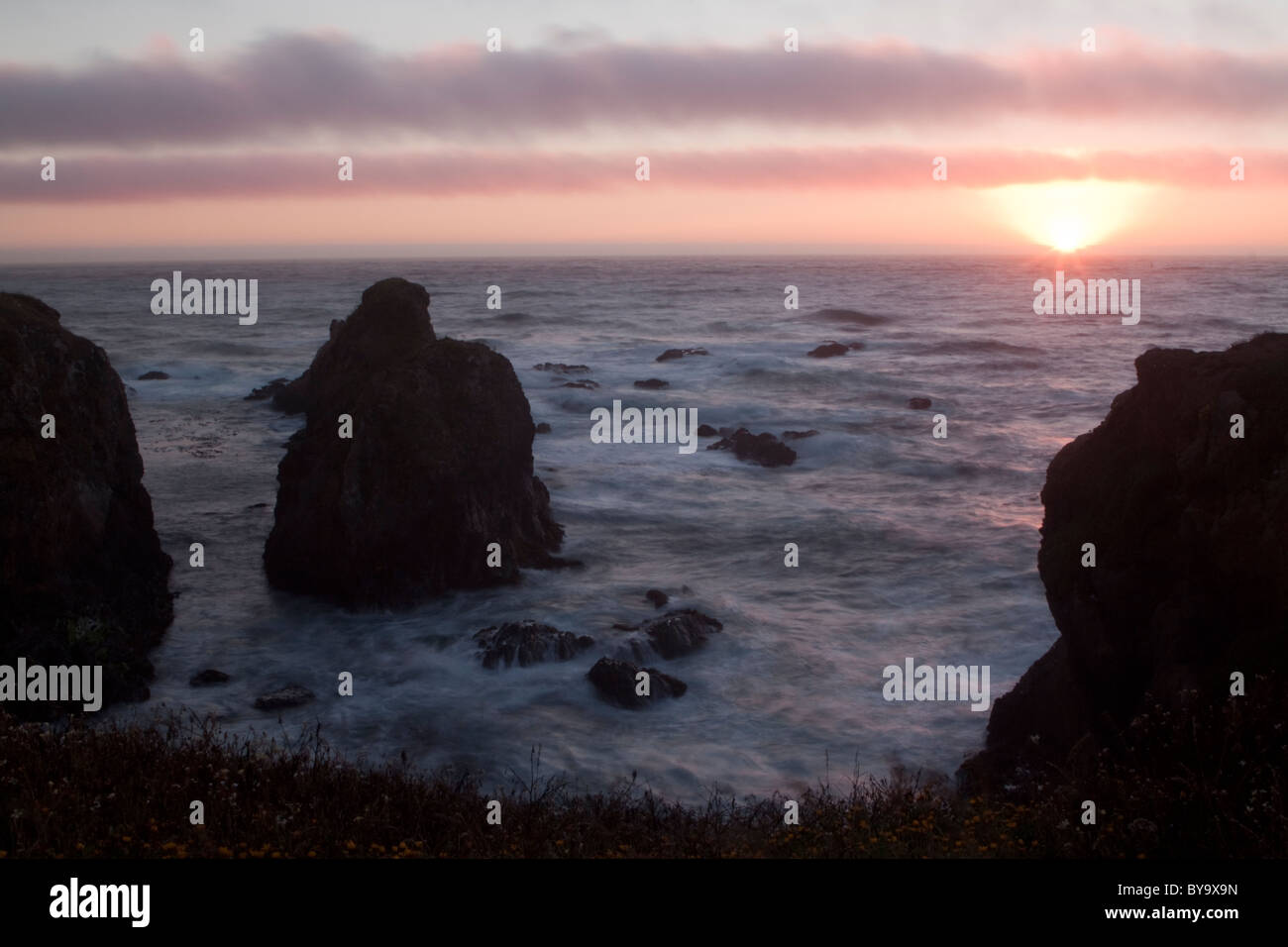 Sunset over the Pacific Ocean on the rocky Mendocino coast near Fort Bragg, CA Stock Photo