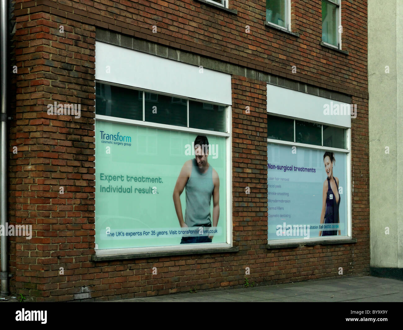 Adverts In Windows Advertising Transform Cosmetic Surgery Group England Stock Photo