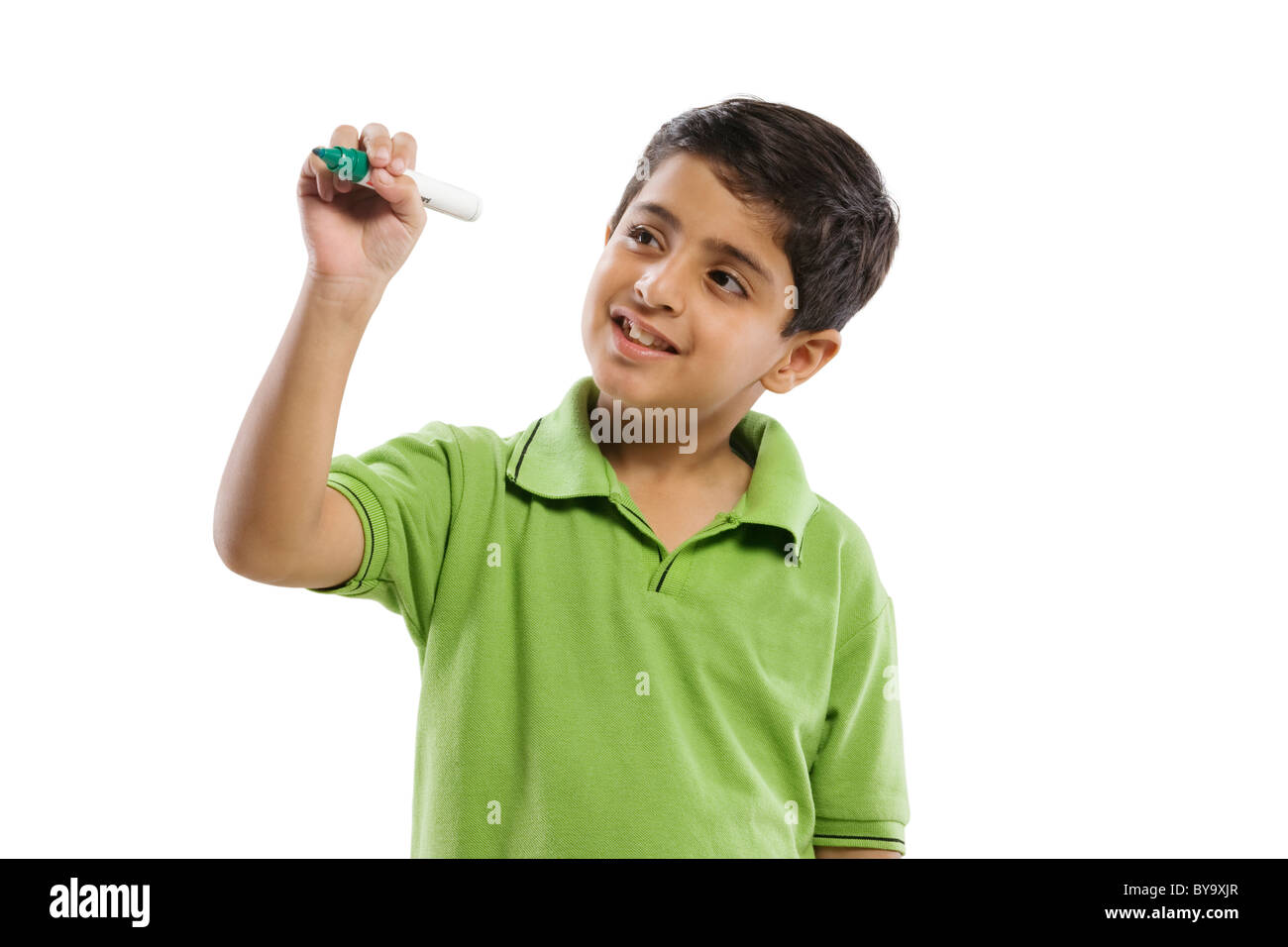 Young boy pretending to write with a marker pen Stock Photo Alamy