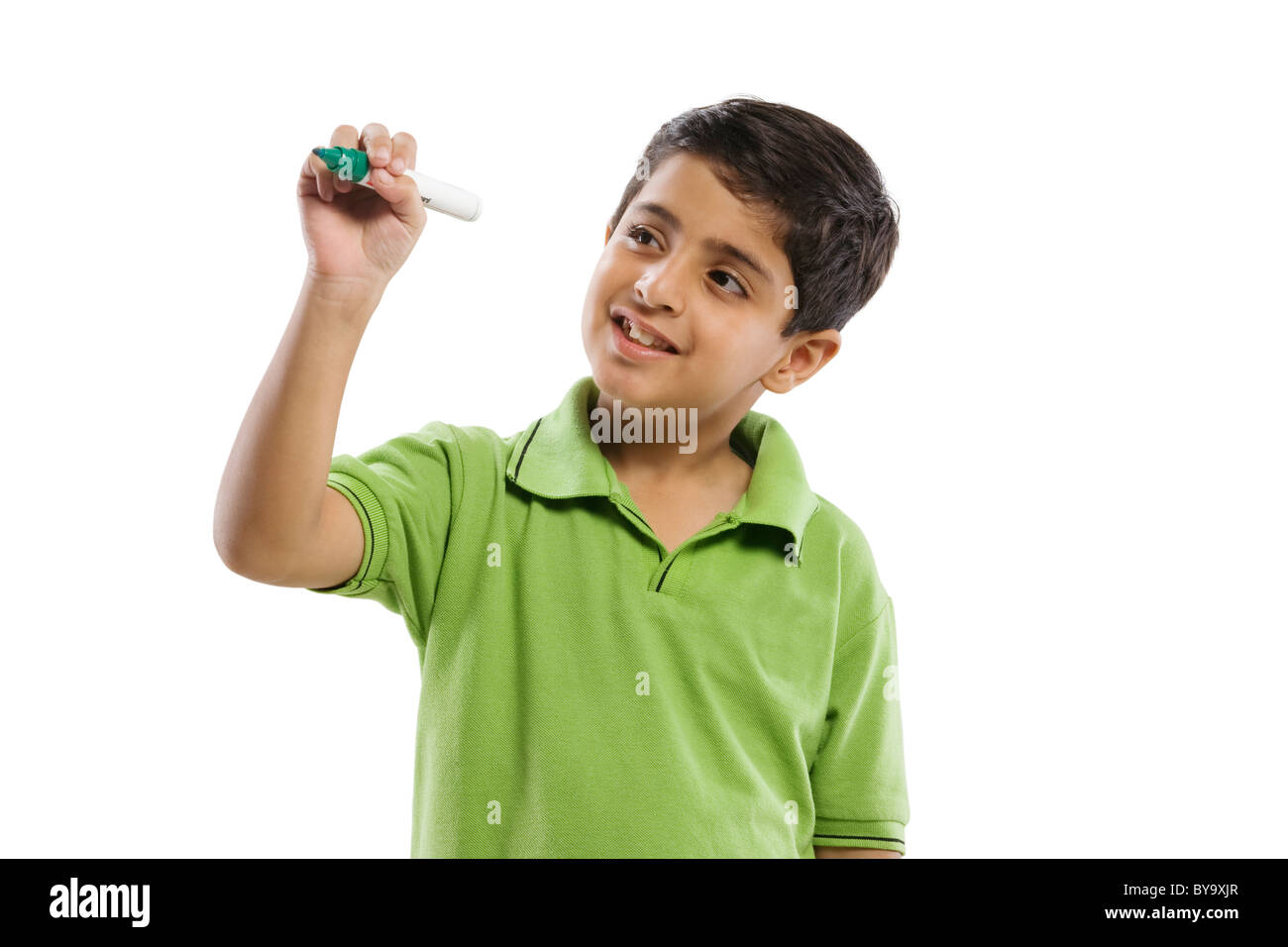 Young boy pretending to write with a marker pen Stock Photo