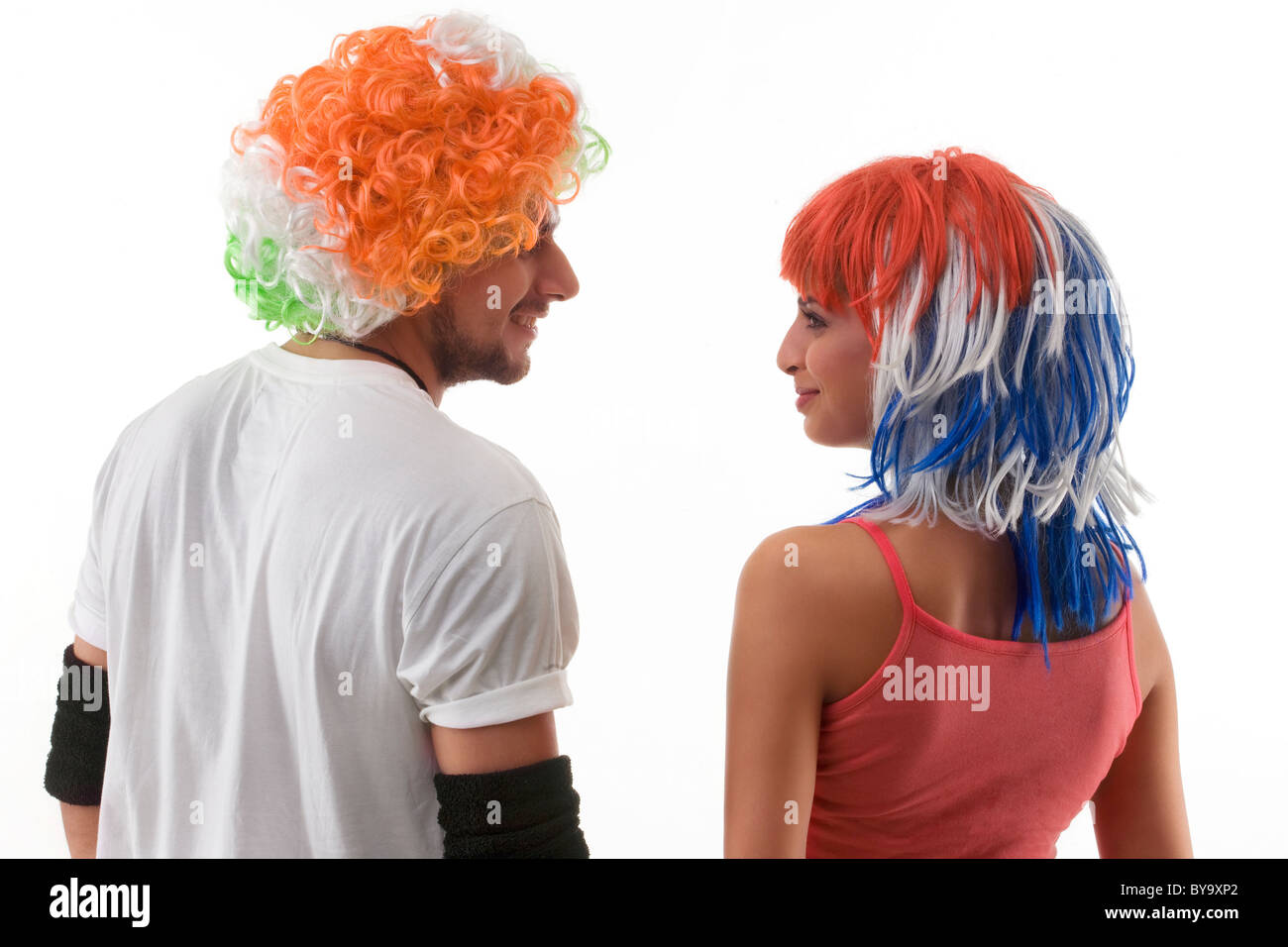 Back view of youngsters wearing wigs Stock Photo