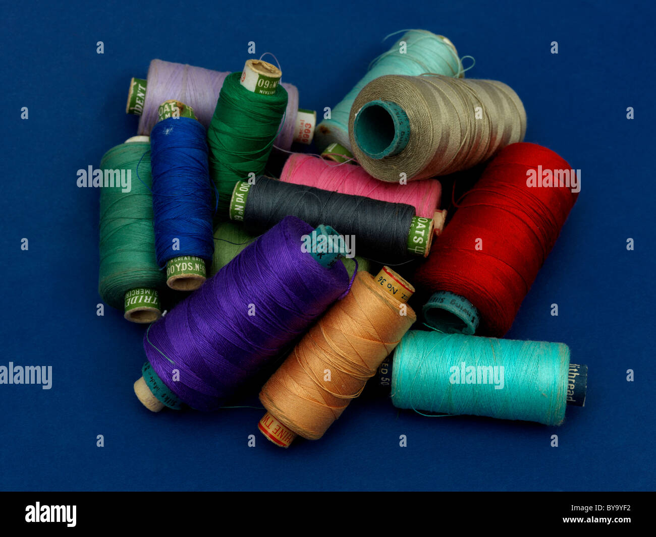 Pile Of Spools Of Colourful Cotton Stock Photo - Alamy