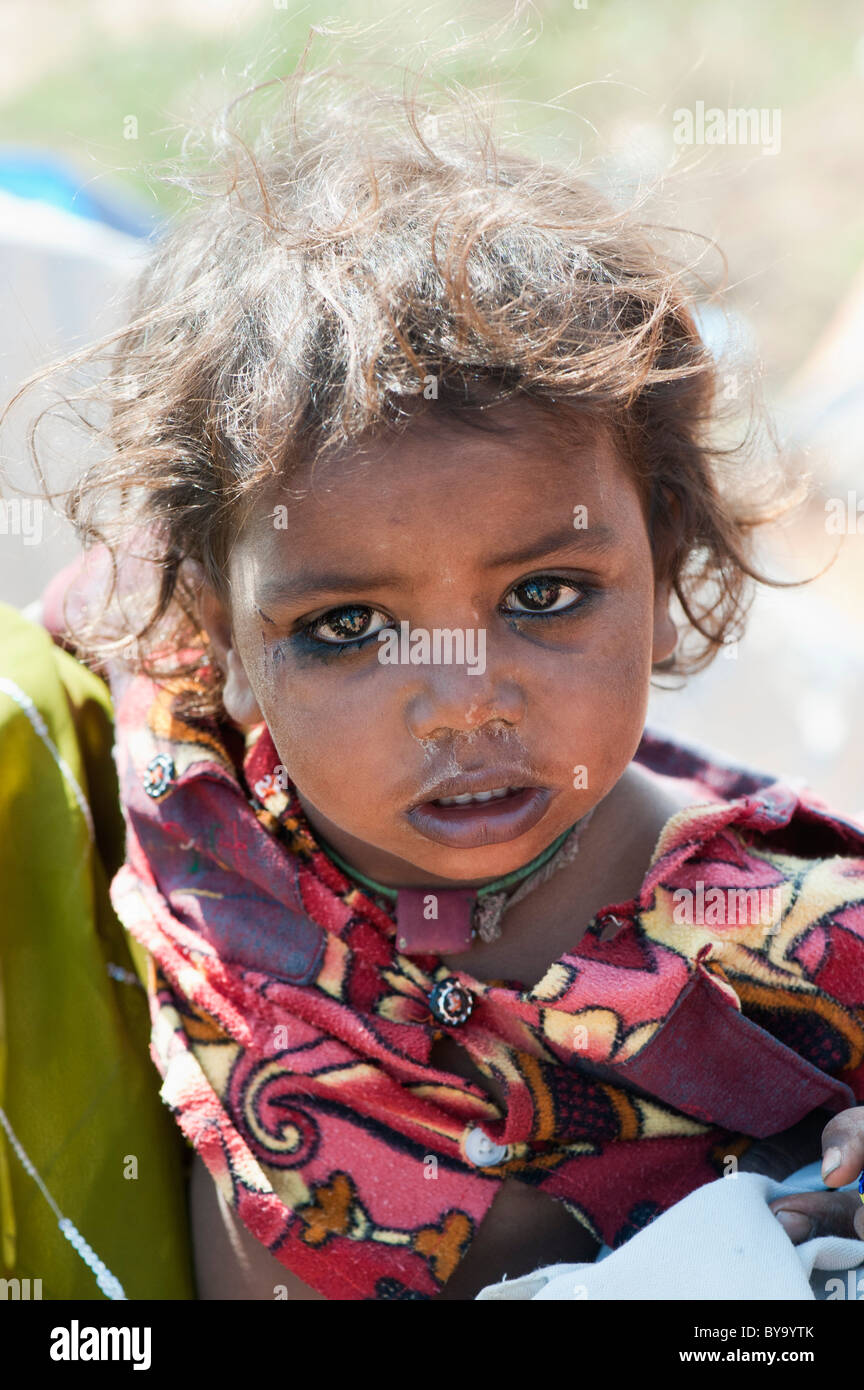 Young indian baby girl in the arms of her sister. Andhra Pradesh, India ...