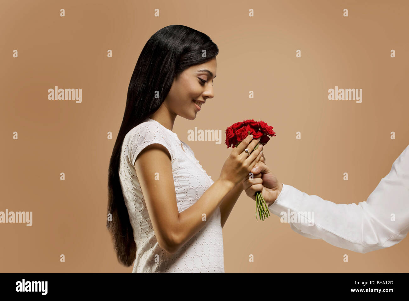 Woman receiving flowers from a man Stock Photo Alamy