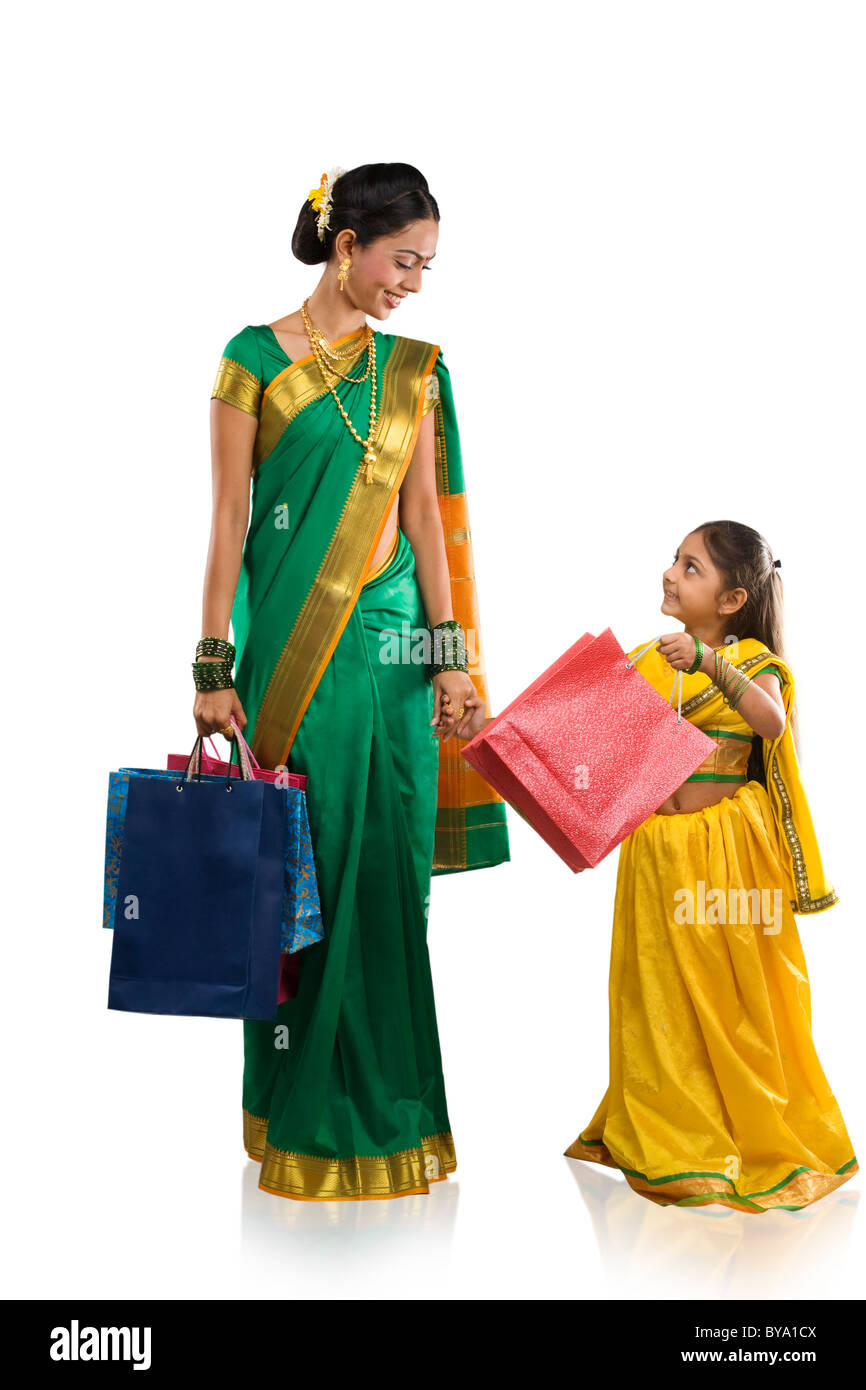 Mother and daughter with shopping bags Stock Photo