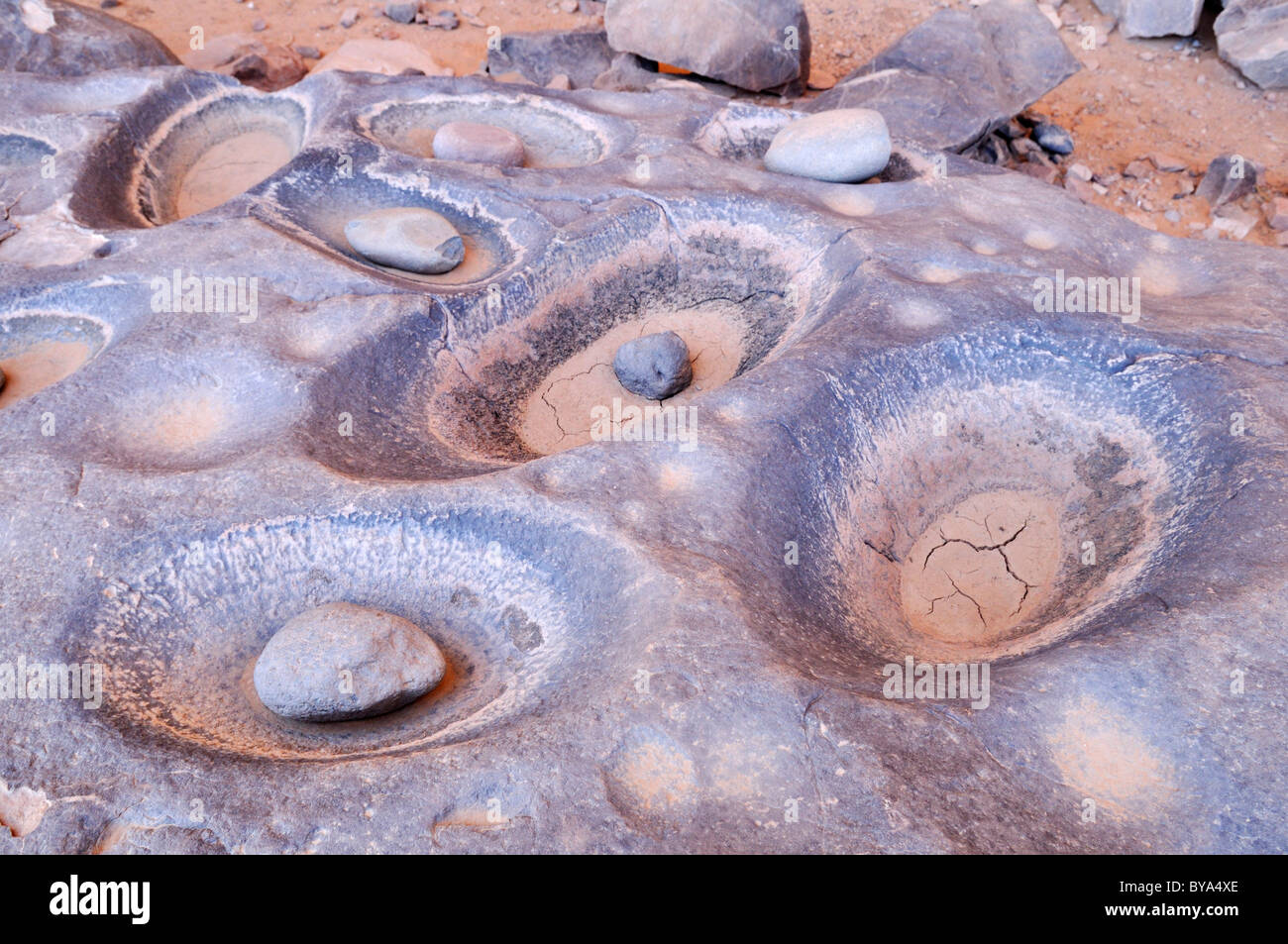 Grinding holes for pigments or grain, Tasset Plateau, Tassili n'Ajjer National Park, Unesco World Heritage Site, Wilaya Illizi Stock Photo
