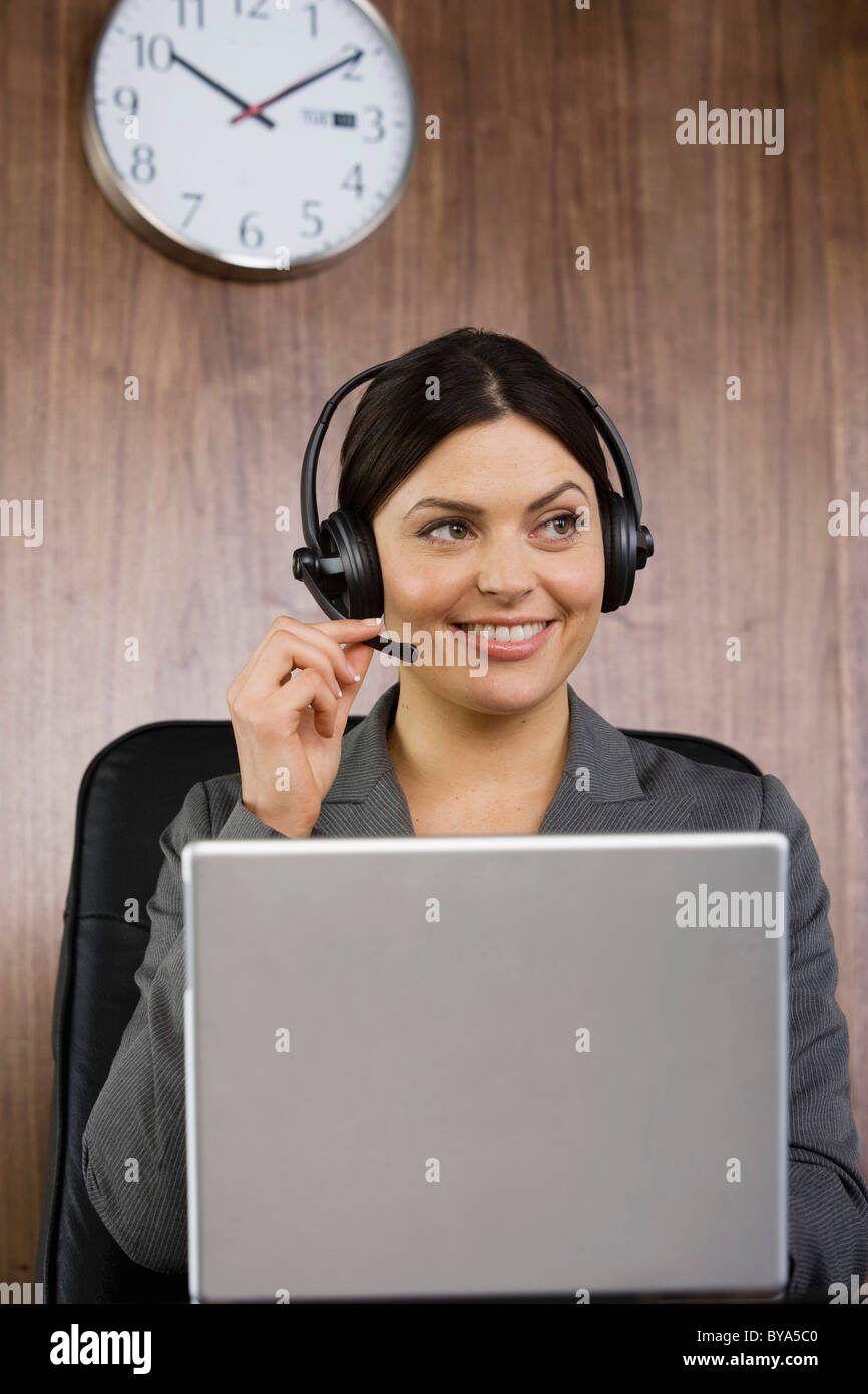 Business woman on telephone headset Stock Photo