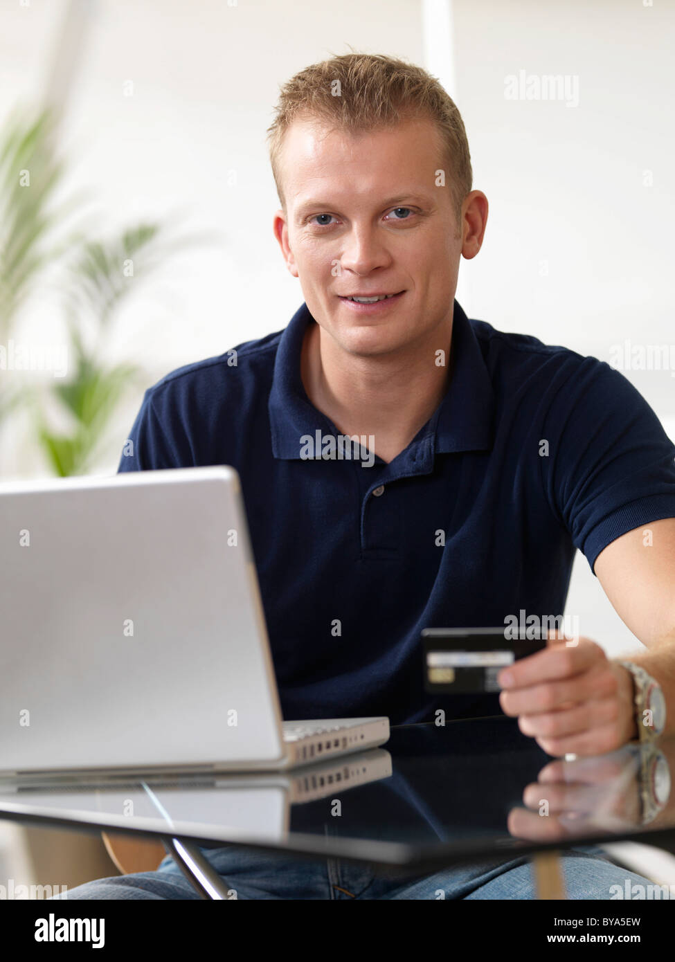 Man at home shopping online Stock Photo