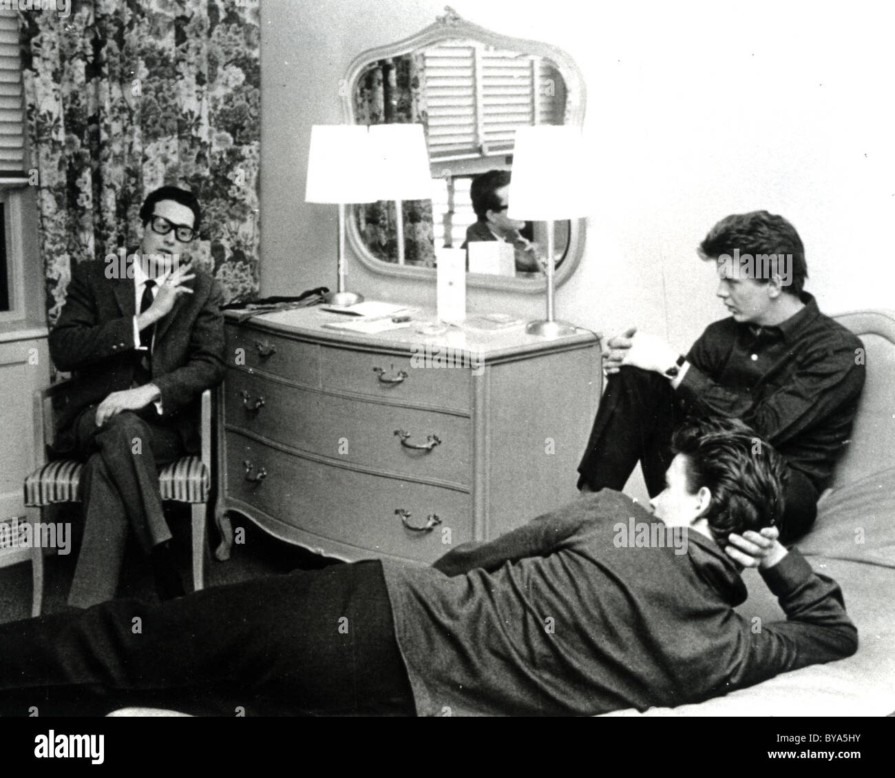 BUDDY HOLLY at left with fellow pop musicians the Everly Brothers Stock