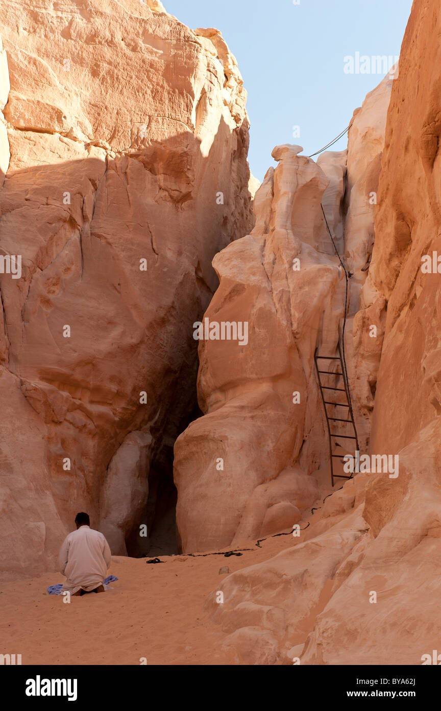 Prayer after the descent into the White Canyon, Sinai, Egypt, North Africa Stock Photo