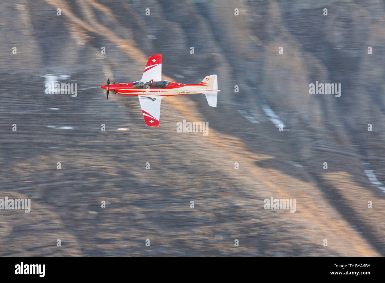 The Swiss military aircraft Pilatus PC-21 between the rocks, mountain-air show of the Swiss Air Force at Axalp, Ebenfluh Stock Photo