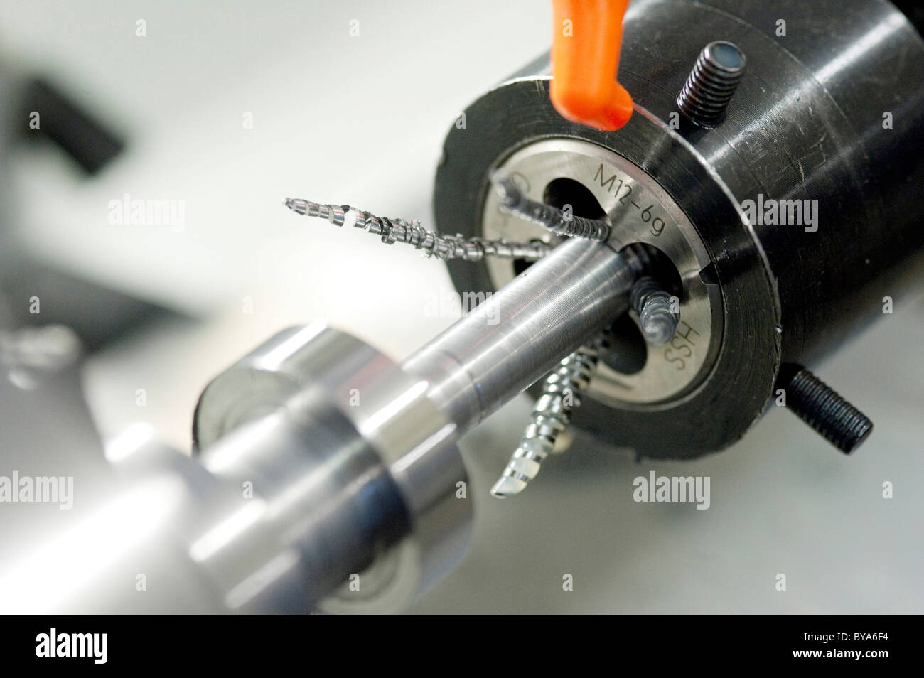 Cutting a screw thread on a lathe Stock Photo
