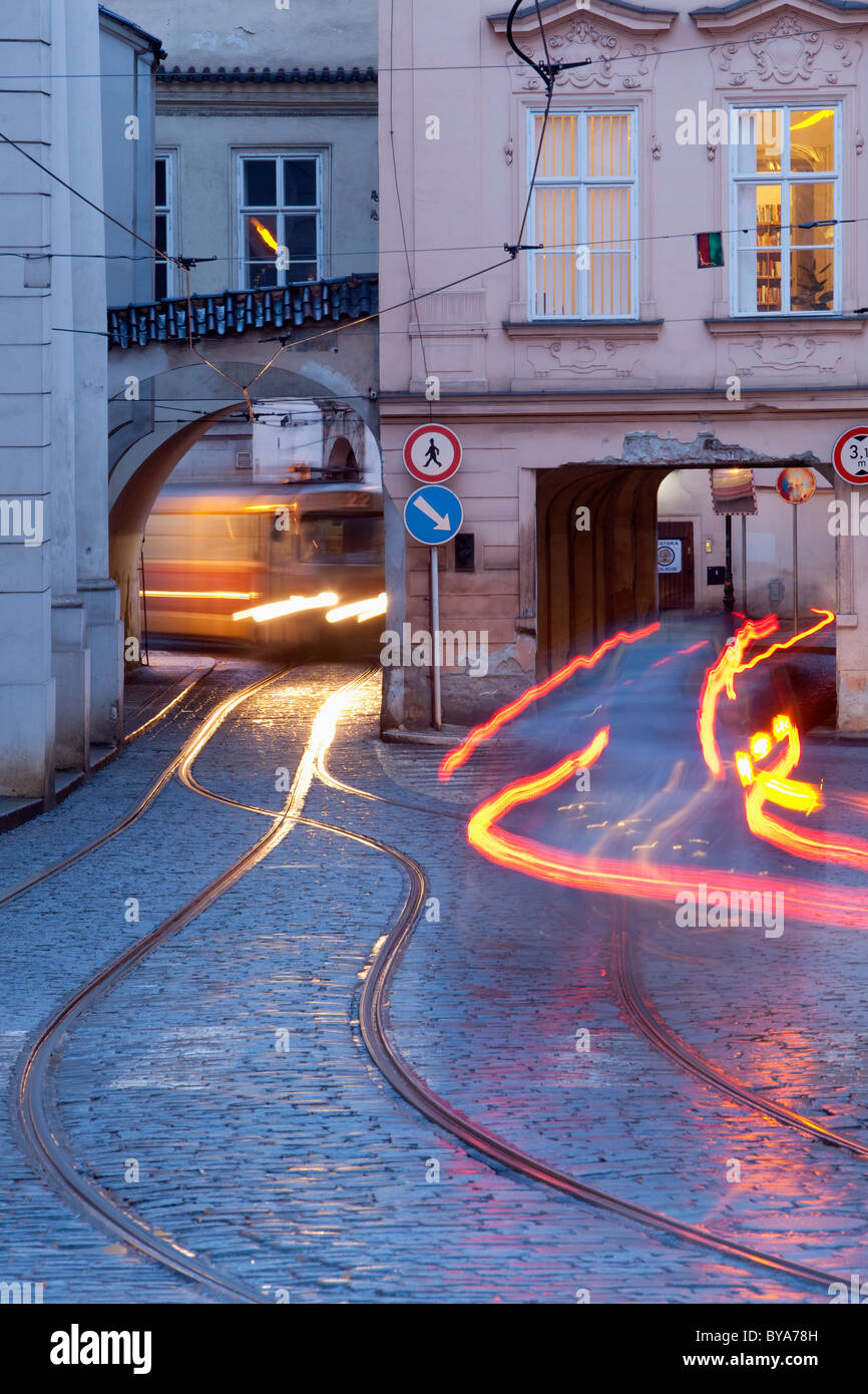 prague - cars and tramways passing under buildings at mala strana Stock Photo