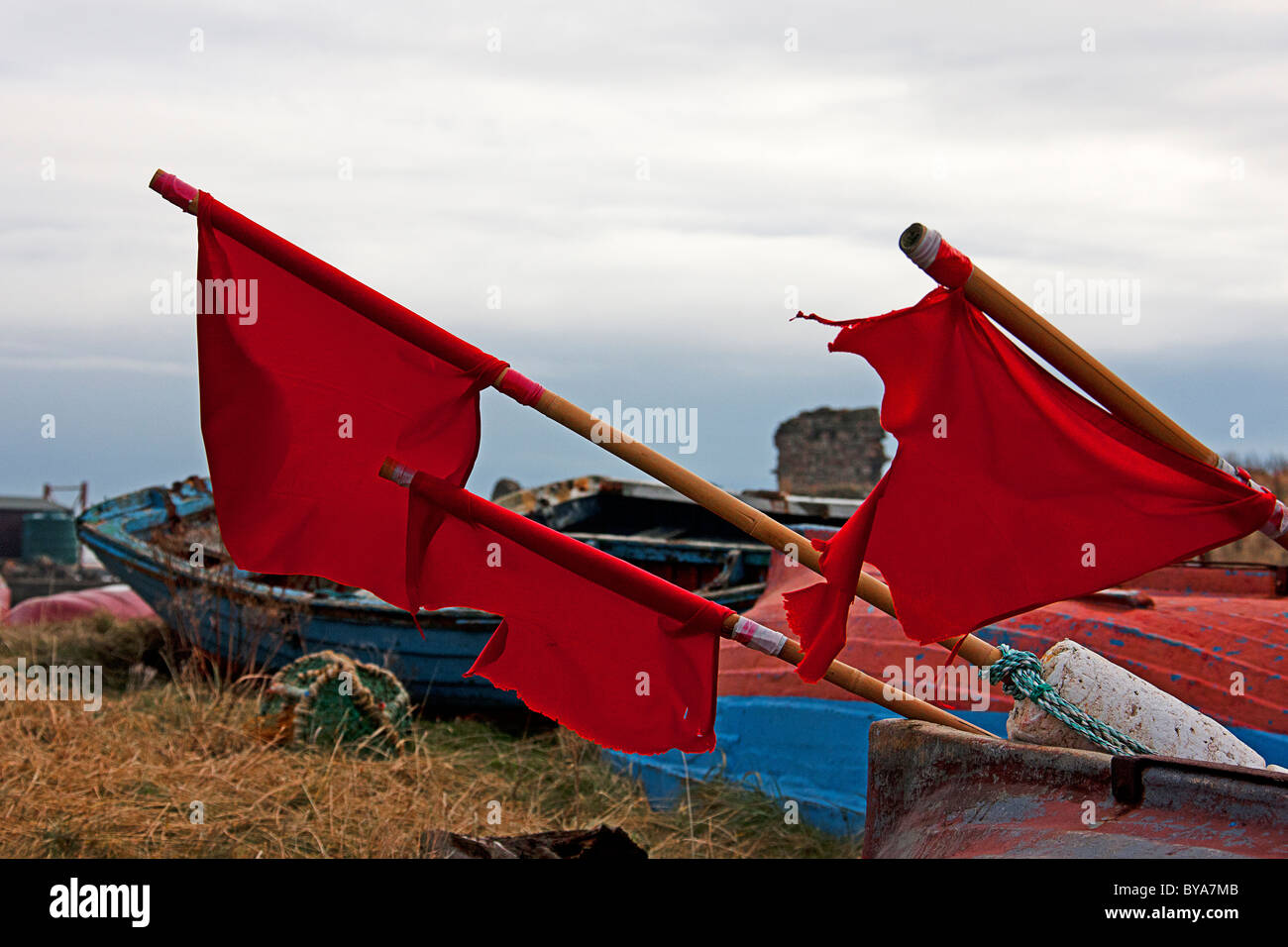 Red flags on 'The Holy Island of Lindisfarne'.Northumberland England Stock Photo
