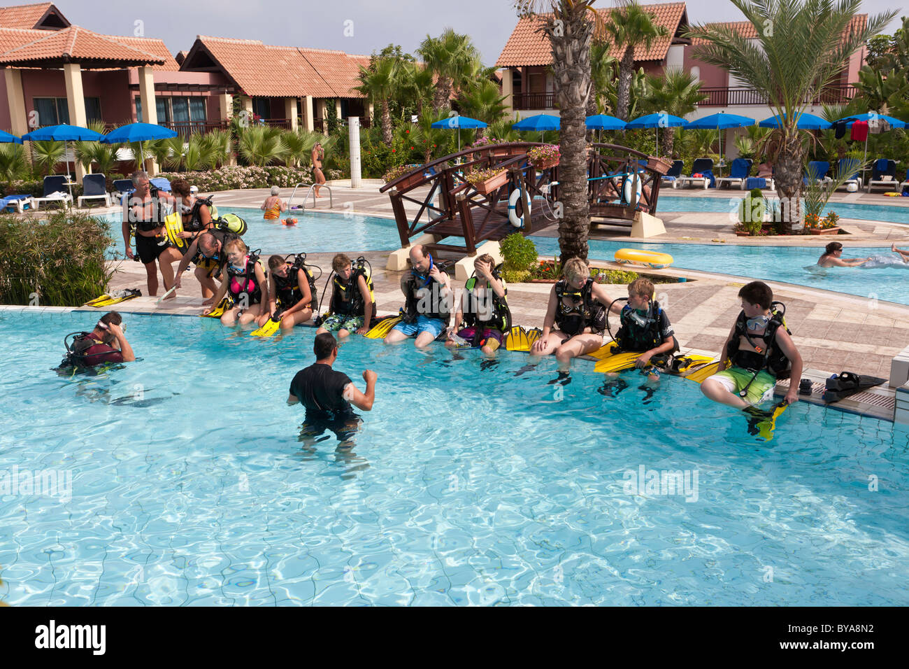 Children are trained by diving instructors in a swimming pool, Club Aldiana, Southern Cyprus, Cyprus Stock Photo