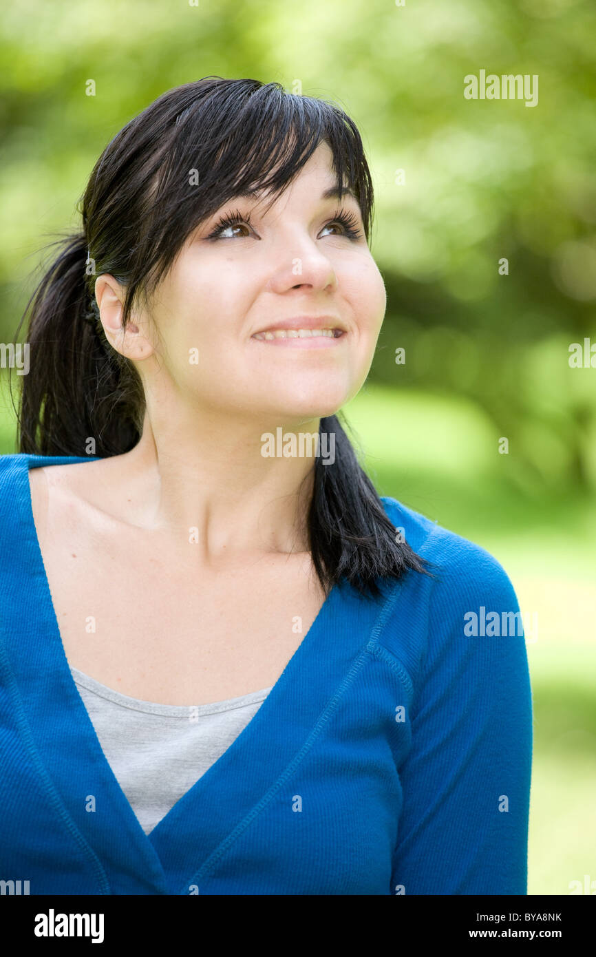 attractive woman relaxing on grass in park Stock Photo - Alamy