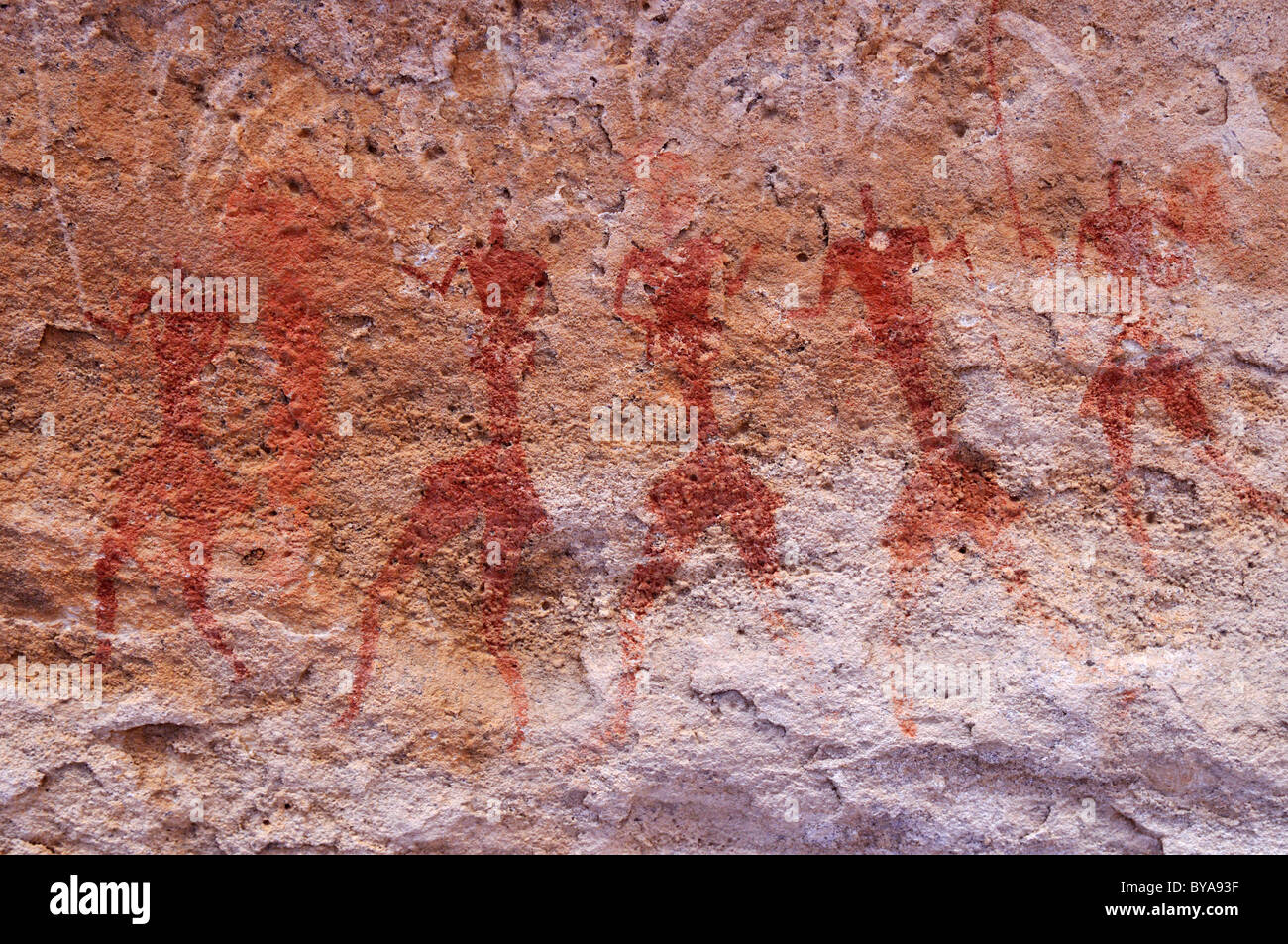 Historic painting of running or dancing people, neolithic rock art of ...