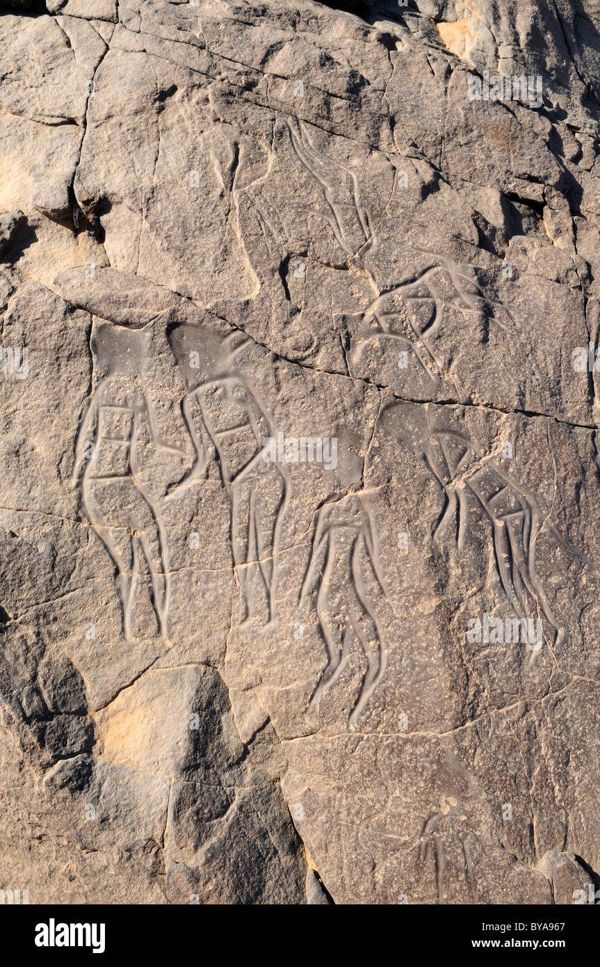Famous rock engraving of people, neolithic rock art of Tinterhert, Dider Valley, Tassili n'Ajjer National Park Stock Photo