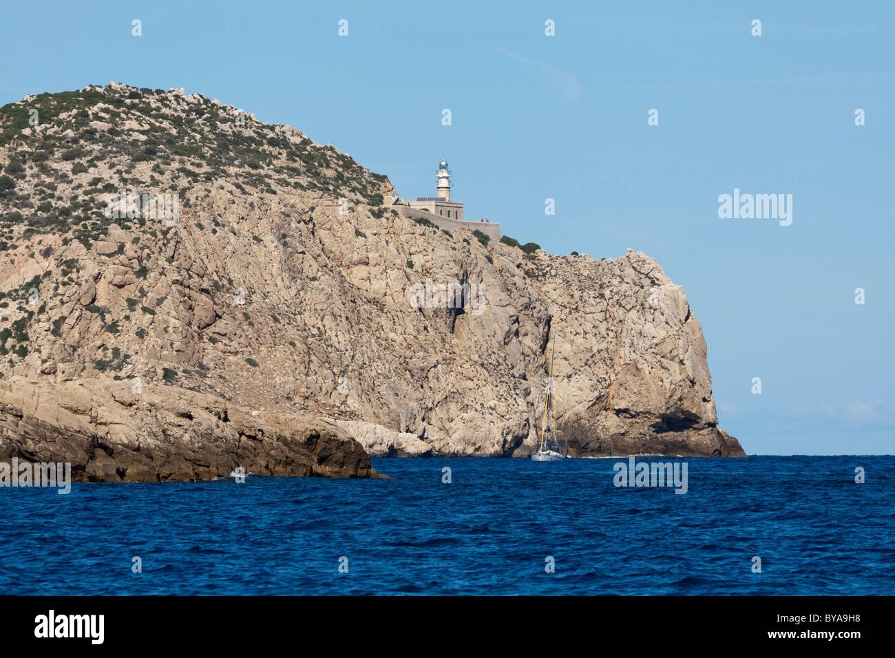Lighthouse at Cap de Tramuntana on Dragon Island, Isla Dragonera, seen from the sea, Majorca, Balearic Islands, Spain, Europe Stock Photo