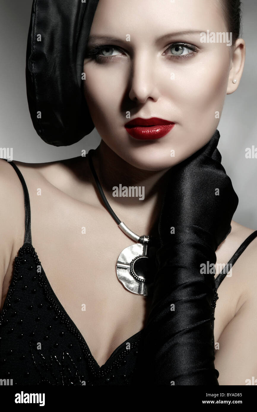 Young woman wearing an elegant hat and a black dress, portrait Stock ...