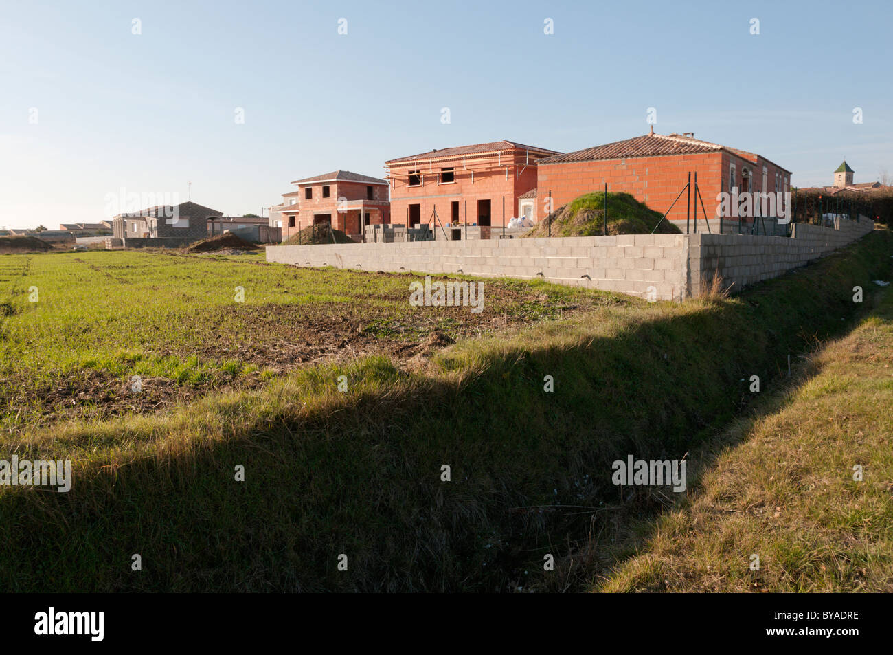 A new housing development being built on the edge of a French village in Languedoc-Roussillon. Stock Photo