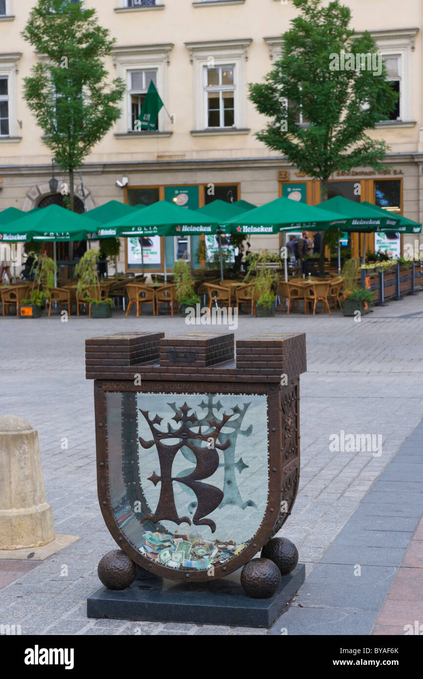 Skarbonka, Piggy Bank, a money box in the shape of Cracow's coat of arms,  Rynek Glowny, Main Market Square, historic district Stock Photo - Alamy