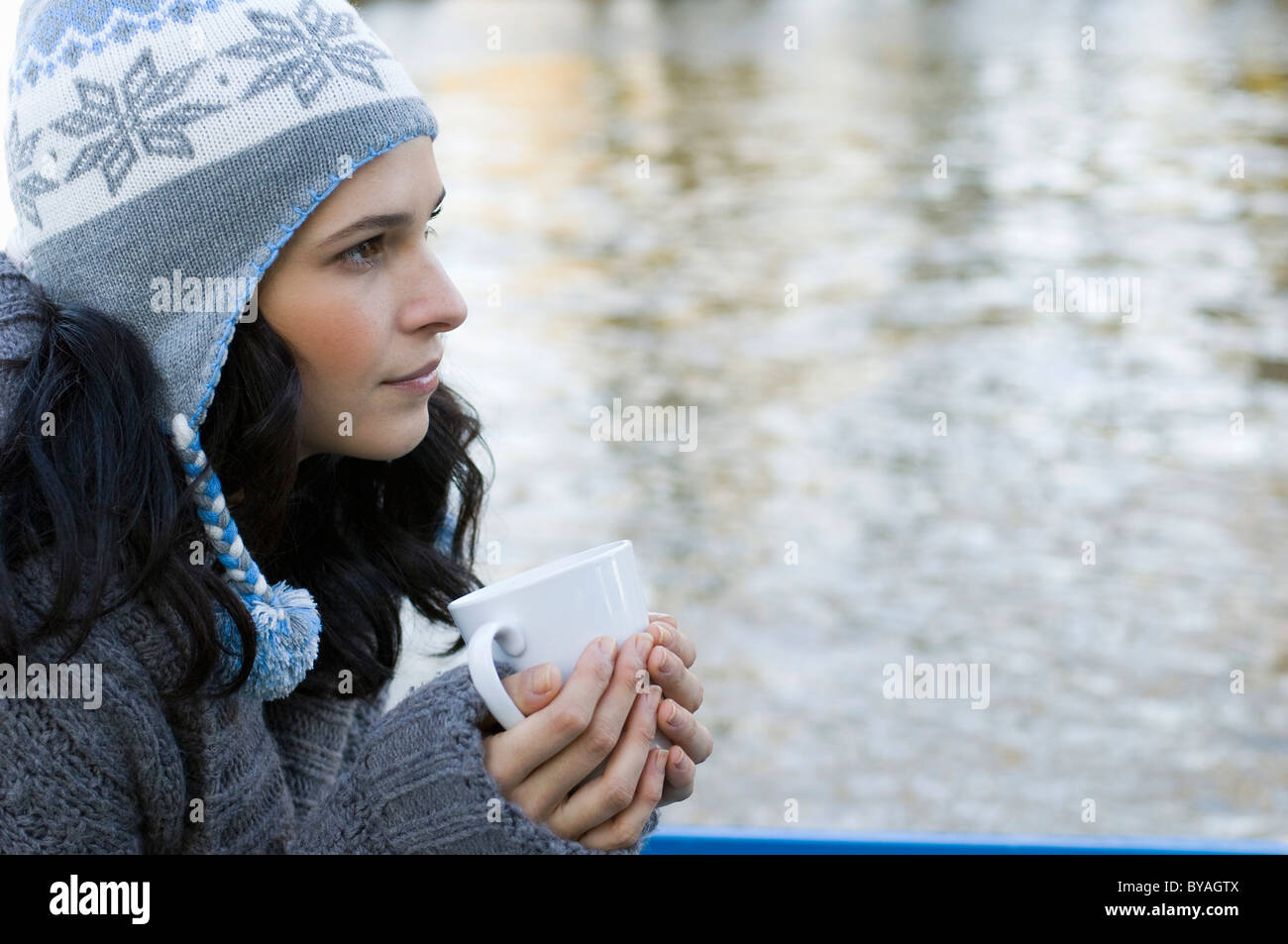 Woman holding mug Stock Photo