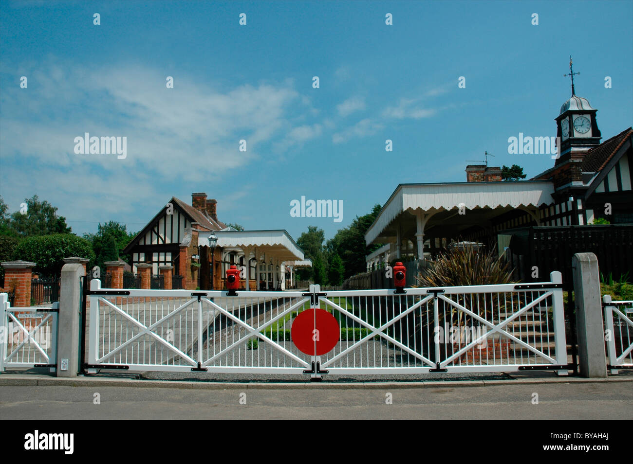 Wolferton - preserved Royal railway station for Sandringham, Norfolk - level crossing gates and station buildings Stock Photo