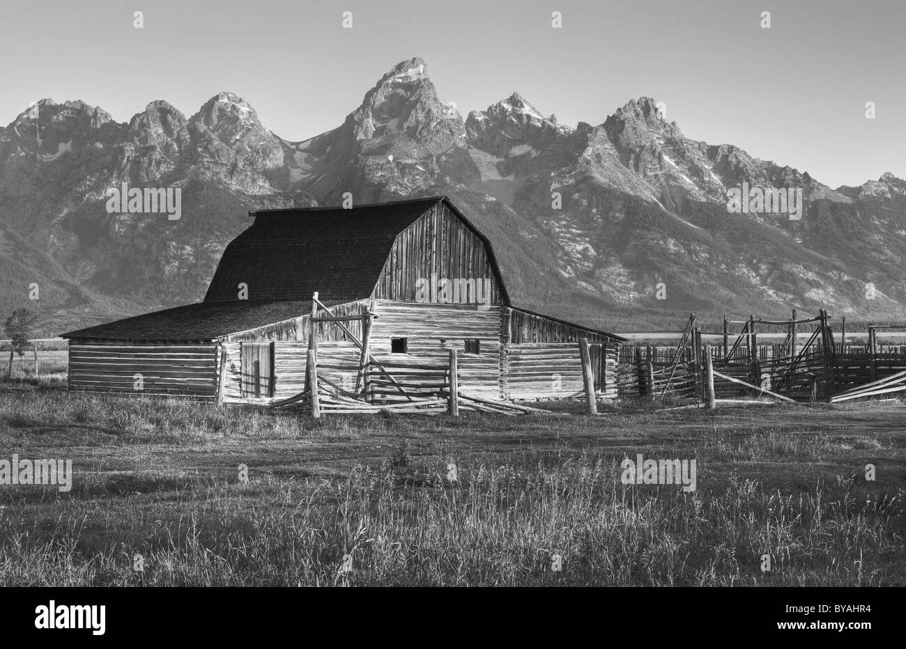 Black and white, Sepia John and Bartha Moulton Homestead Mormon Barn in the morning, historic barn in front of the Teton Range Stock Photo