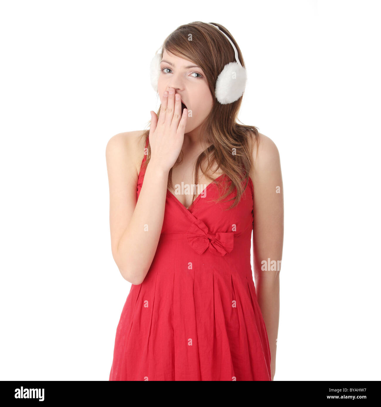 Pretty young teen girl wearing red dress and white earmuff, isolated on  white Stock Photo - Alamy