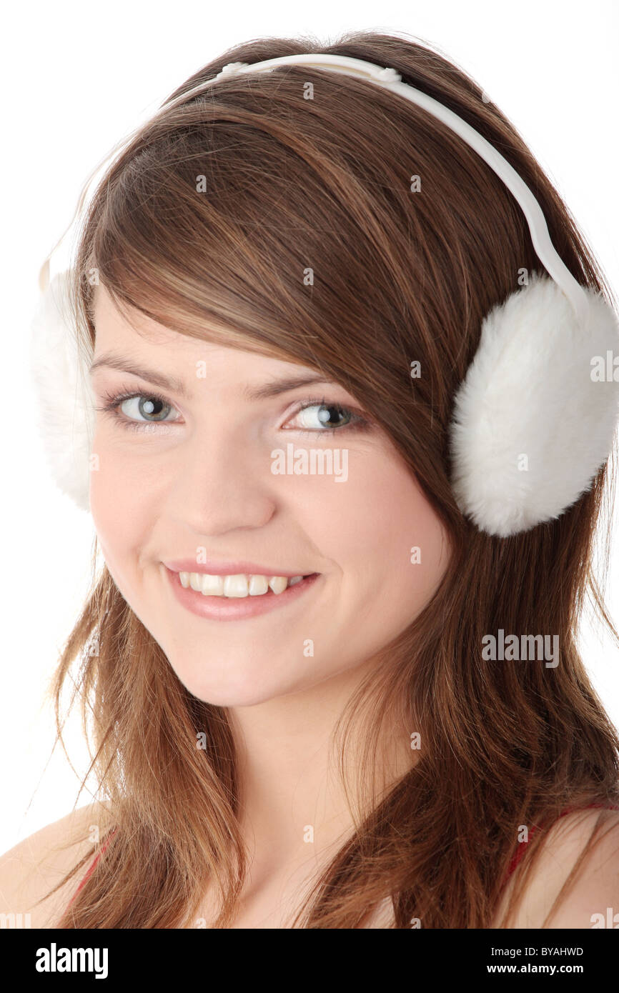 Pretty young teen girl wearing white earmuff, isolated on white Stock Photo  - Alamy