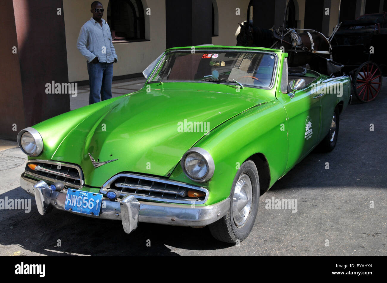 Green classic car on Central Plaza square, historic district, Havana, Cuba, Caribbean, Central America Stock Photo