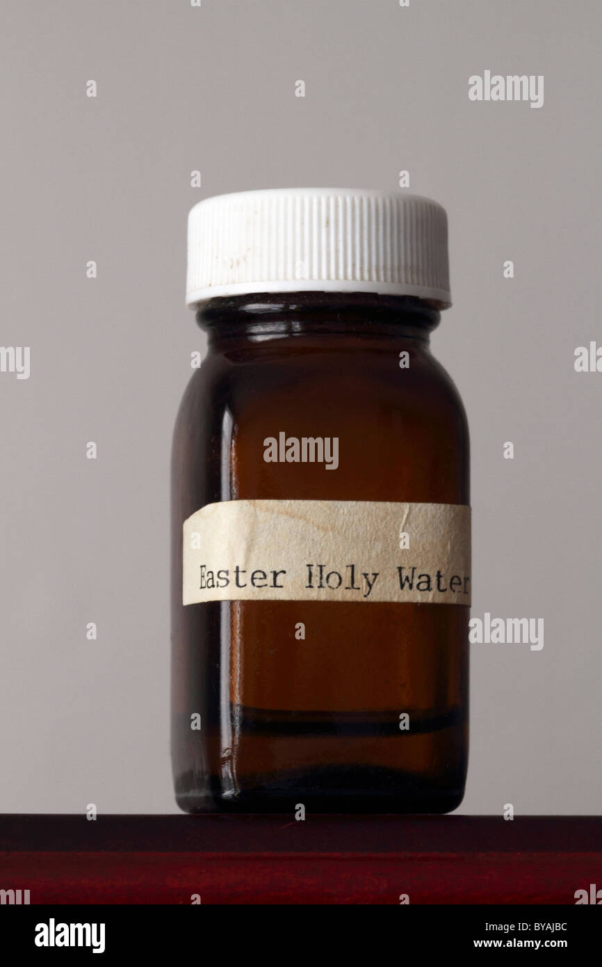 An old bottle containing Easter Holy Water Stock Photo