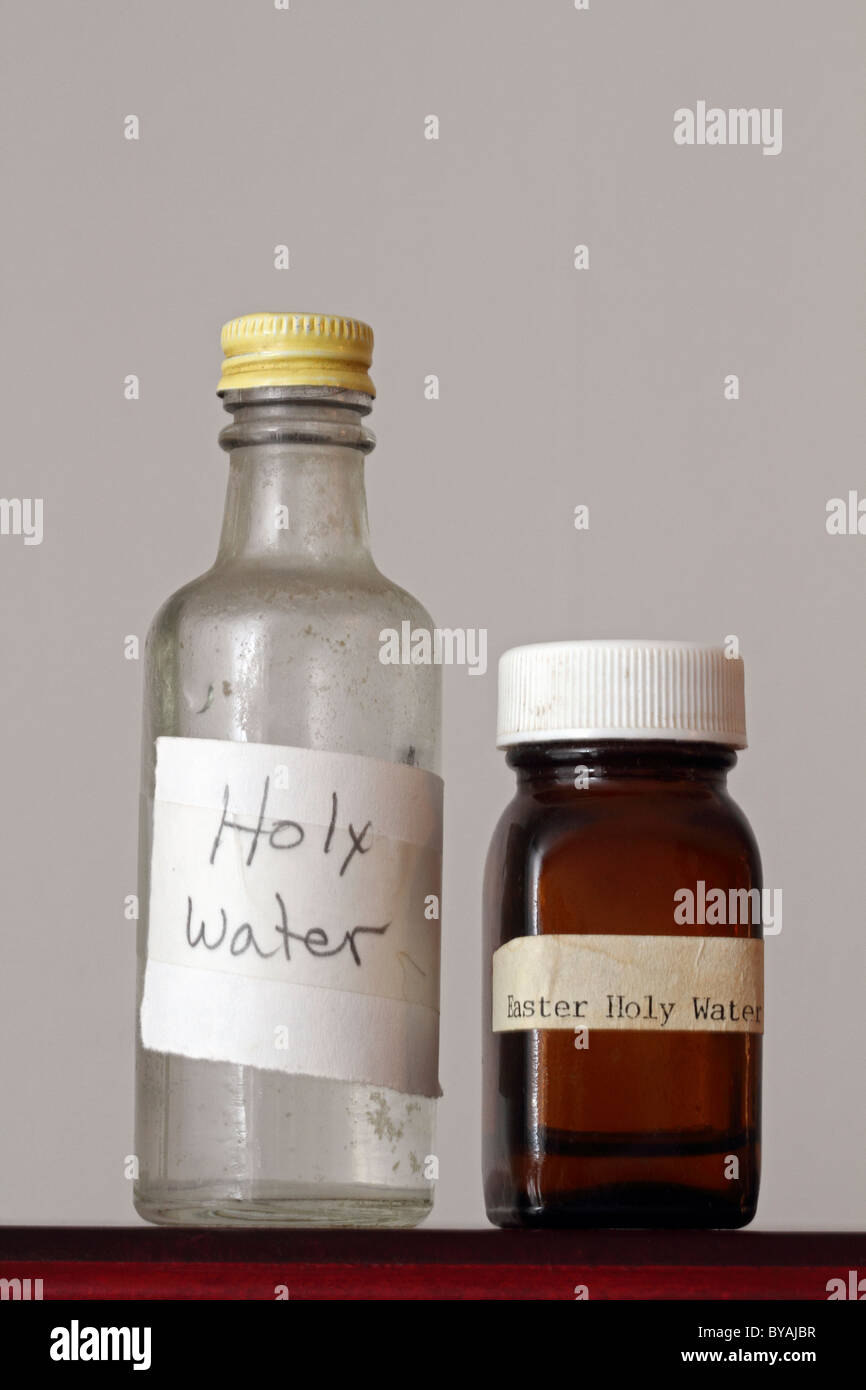 Two old bottles containing Holy Water Stock Photo