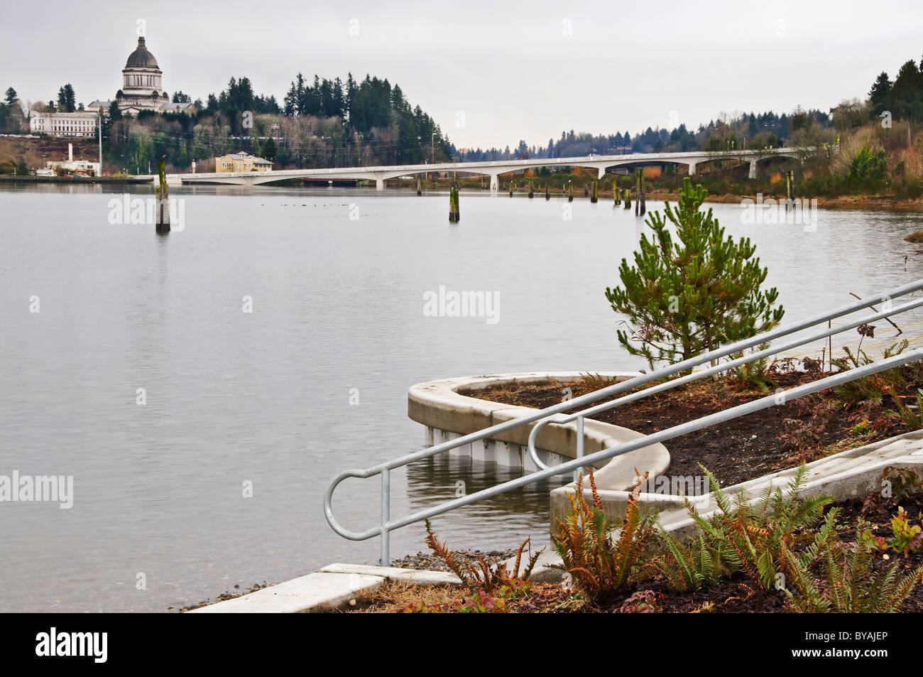 Extremely high king tide in Olympia's Budd Inlet viewed from Rotary Park on the west side of the bay. Stock Photo
