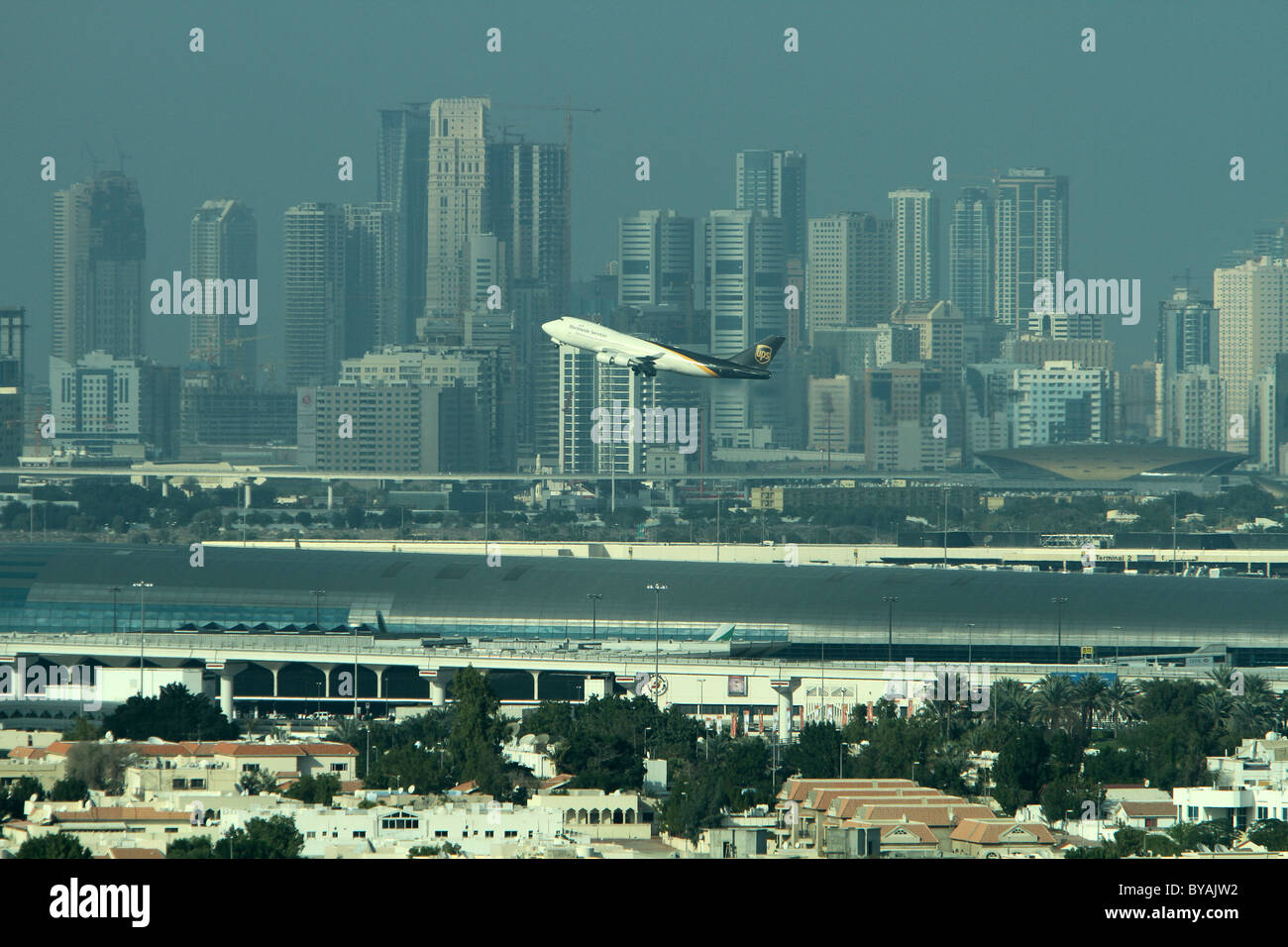 A plane takes off from Dubai's new International Airport terminal Stock Photo