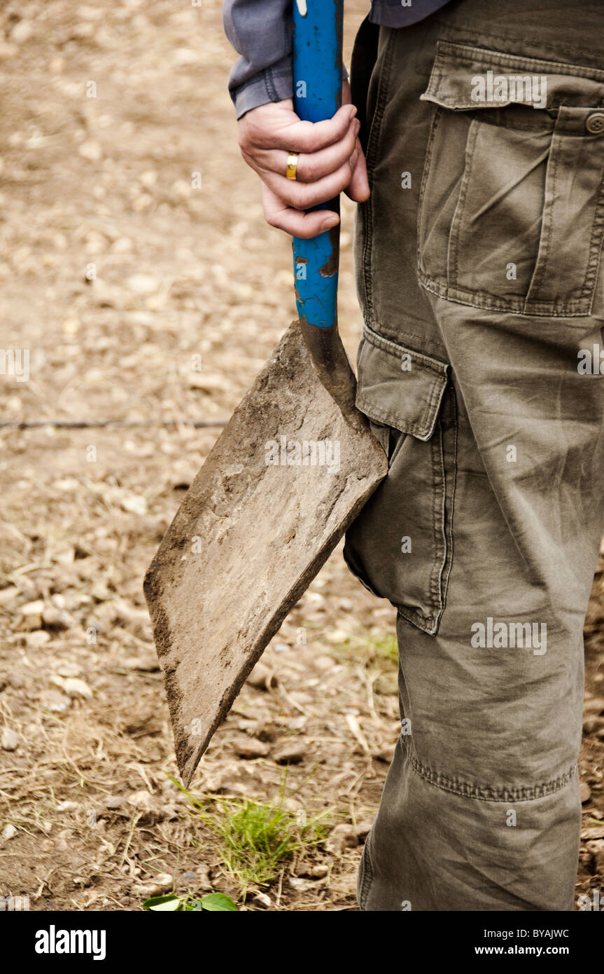 close up of adult hand holding a spade Stock Photo